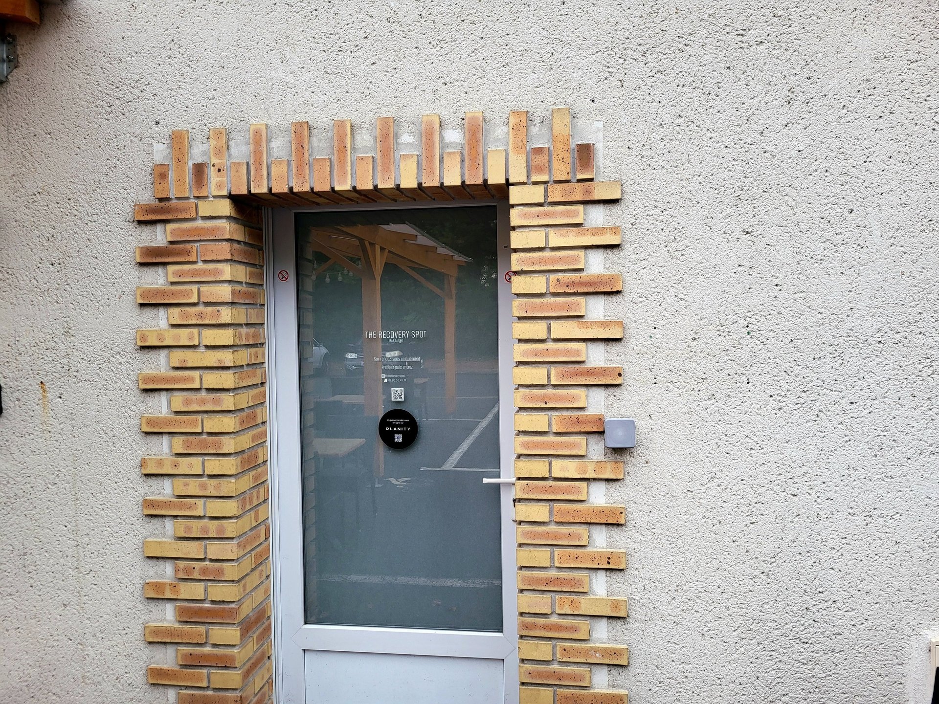 an abstract photo of a curved building with a blue sky in the background