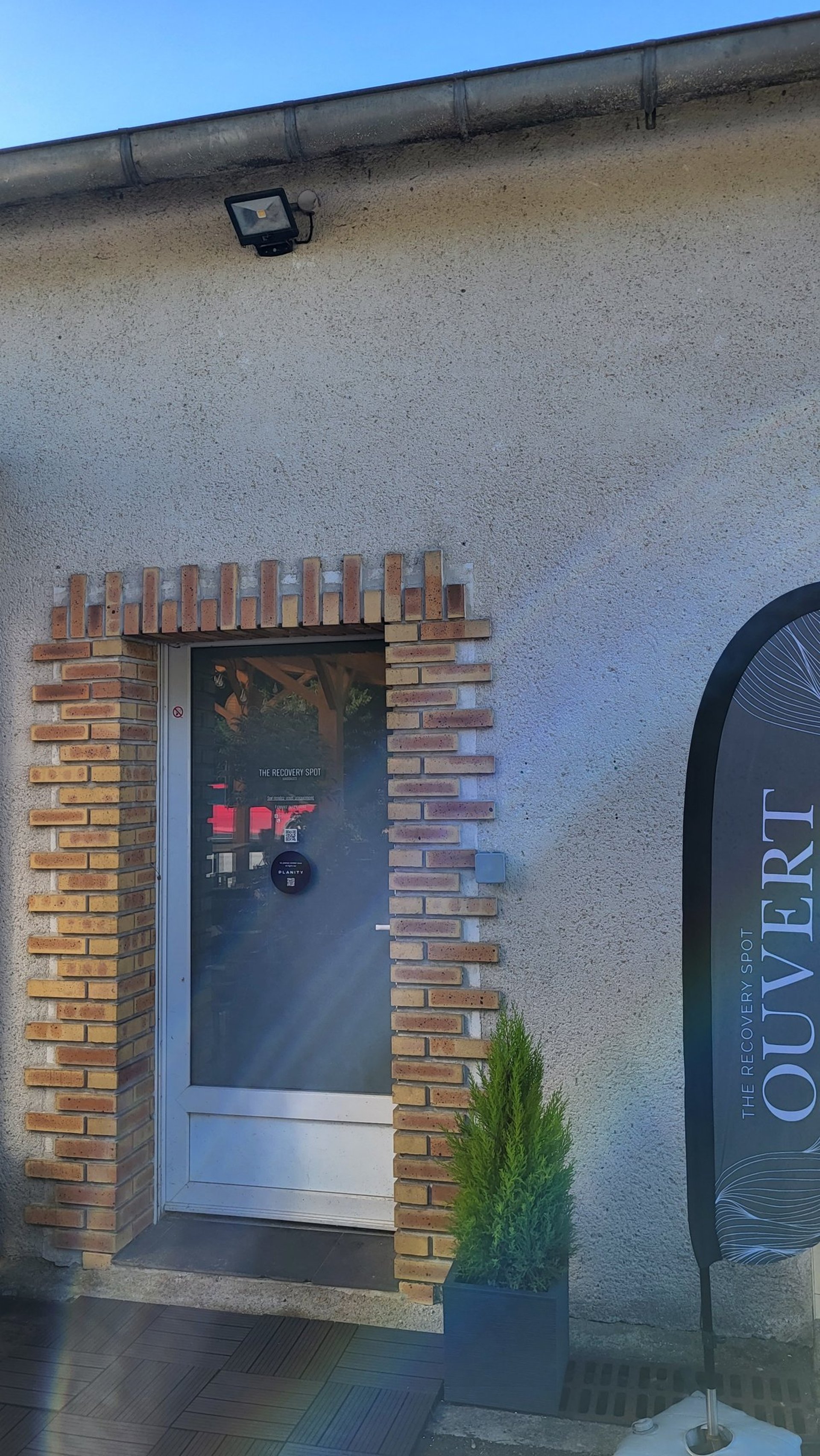 an abstract photo of a curved building with a blue sky in the background