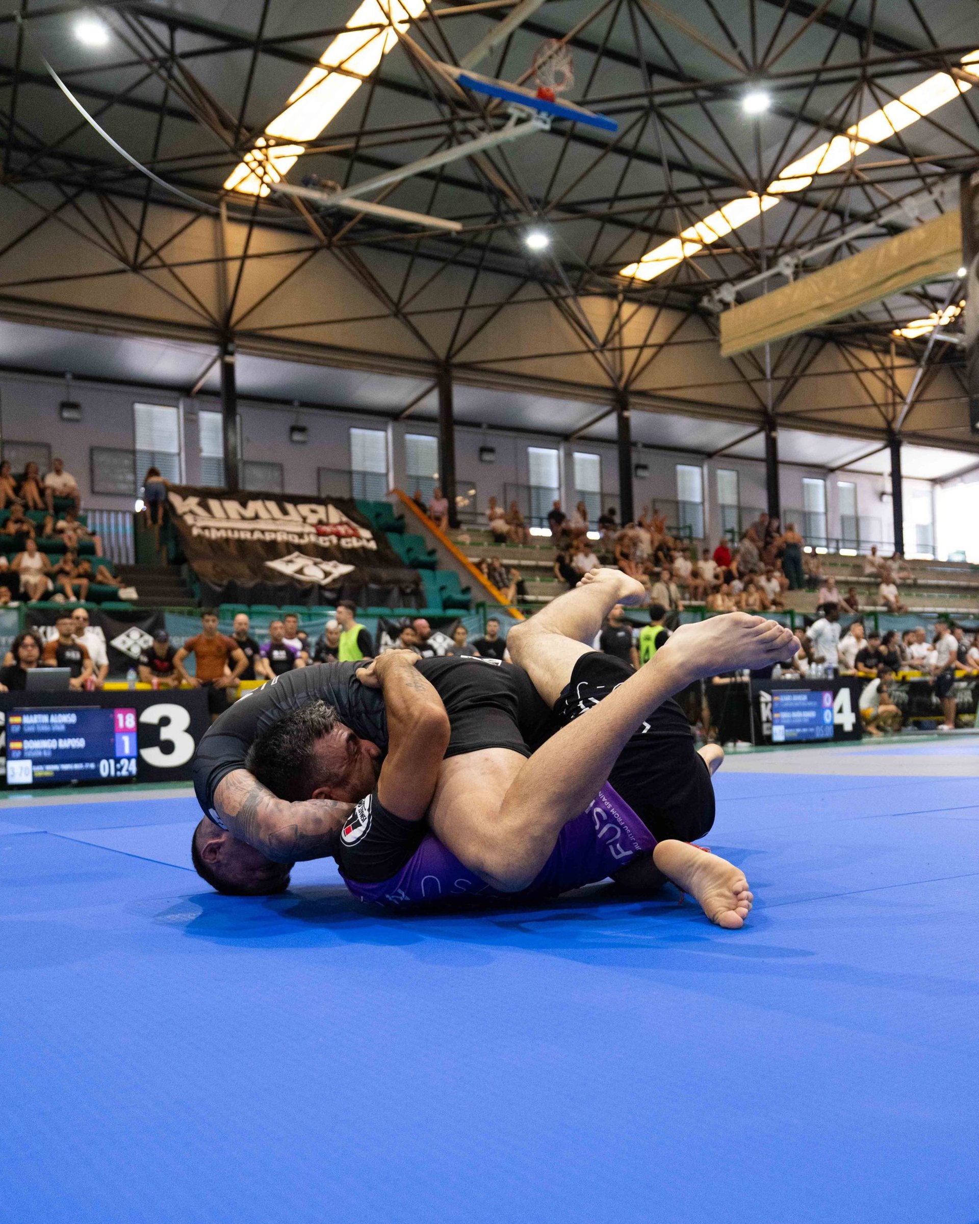 an abstract photo of a curved building with a blue sky in the background