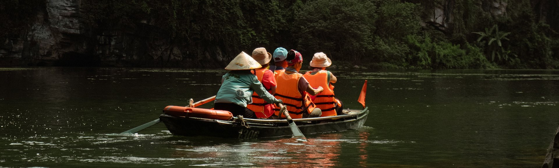 Woman rowing a boat in Ninh Binh, Vietnam