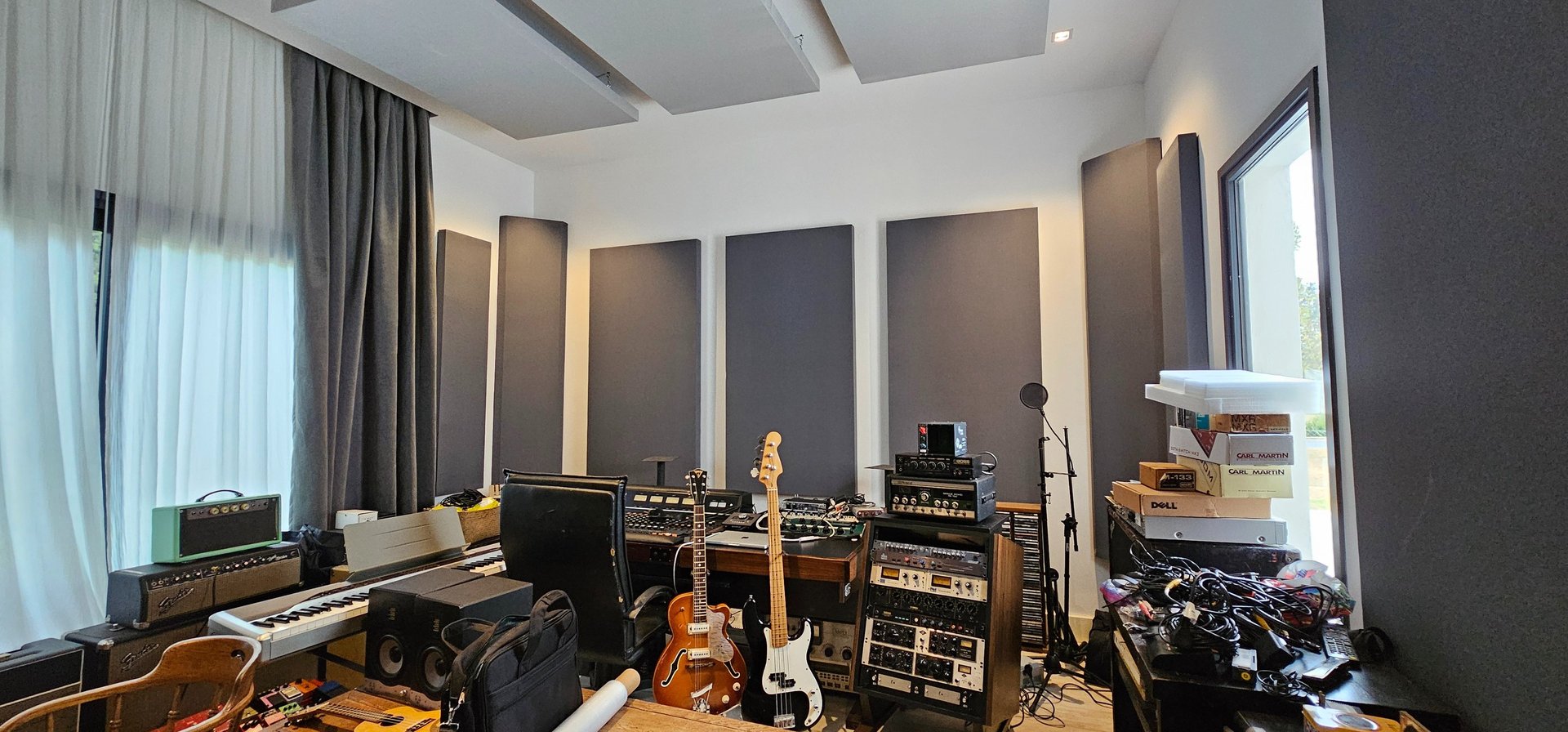 A recording studio with instruments and equipment.