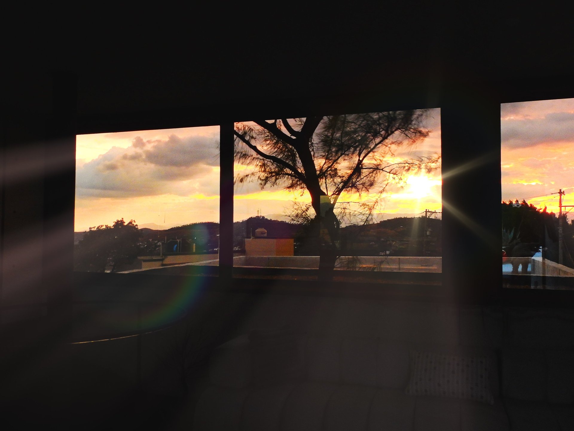 an abstract photo of a curved building with a blue sky in the background
