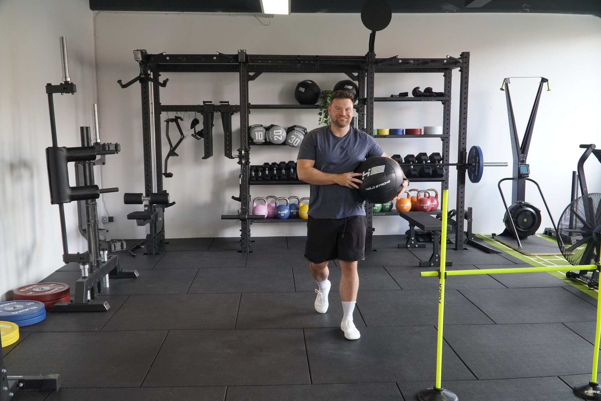 brown wooden house near lake surrounded by green trees during daytime