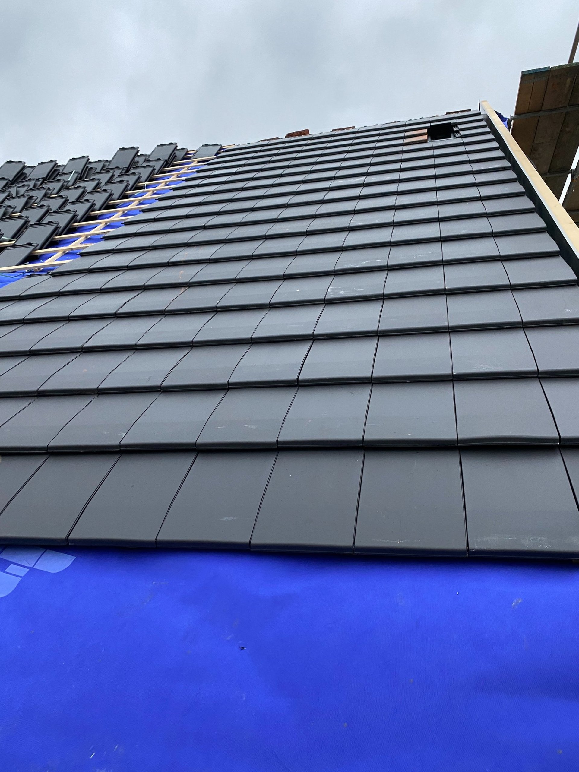 black and brown leather padded tub sofa