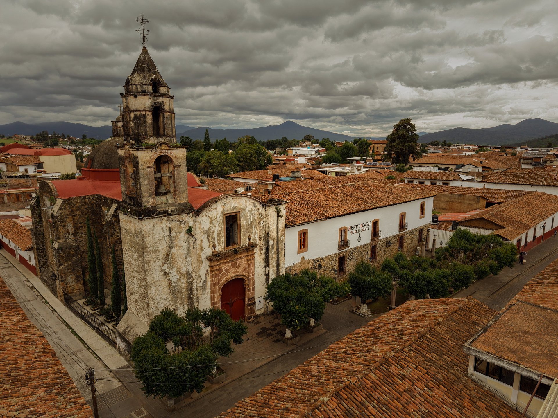 an abstract photo of a curved building with a blue sky in the background