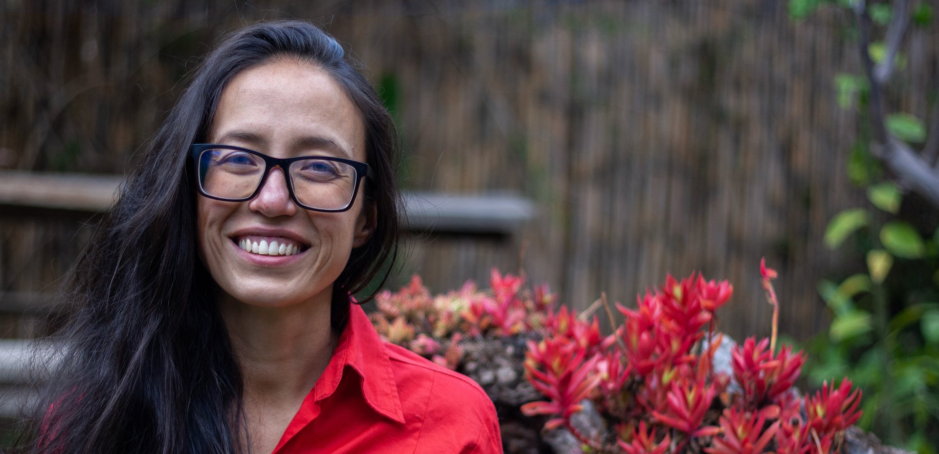woman sitting while reading book