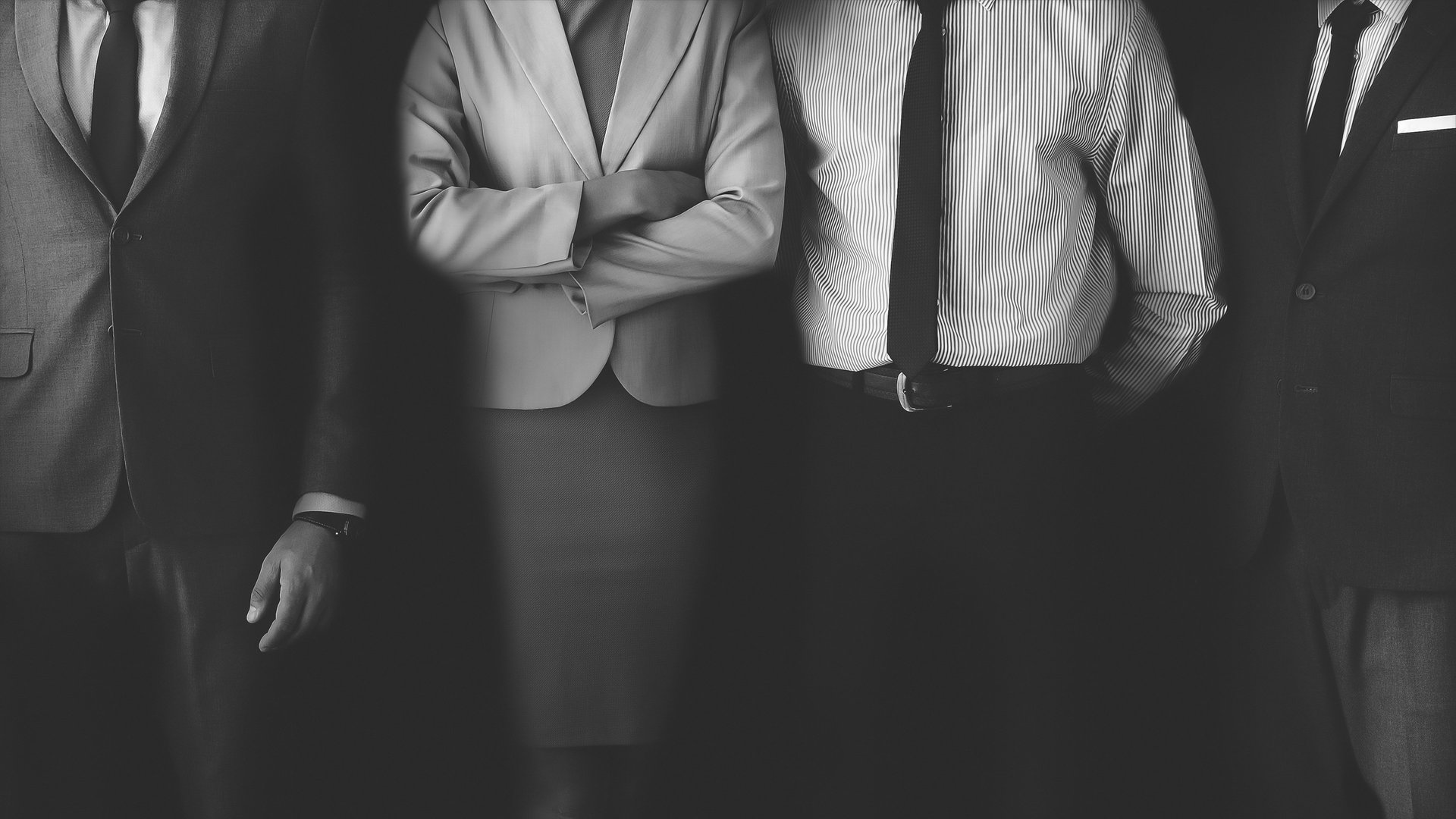 person in black long sleeve shirt holding persons hand