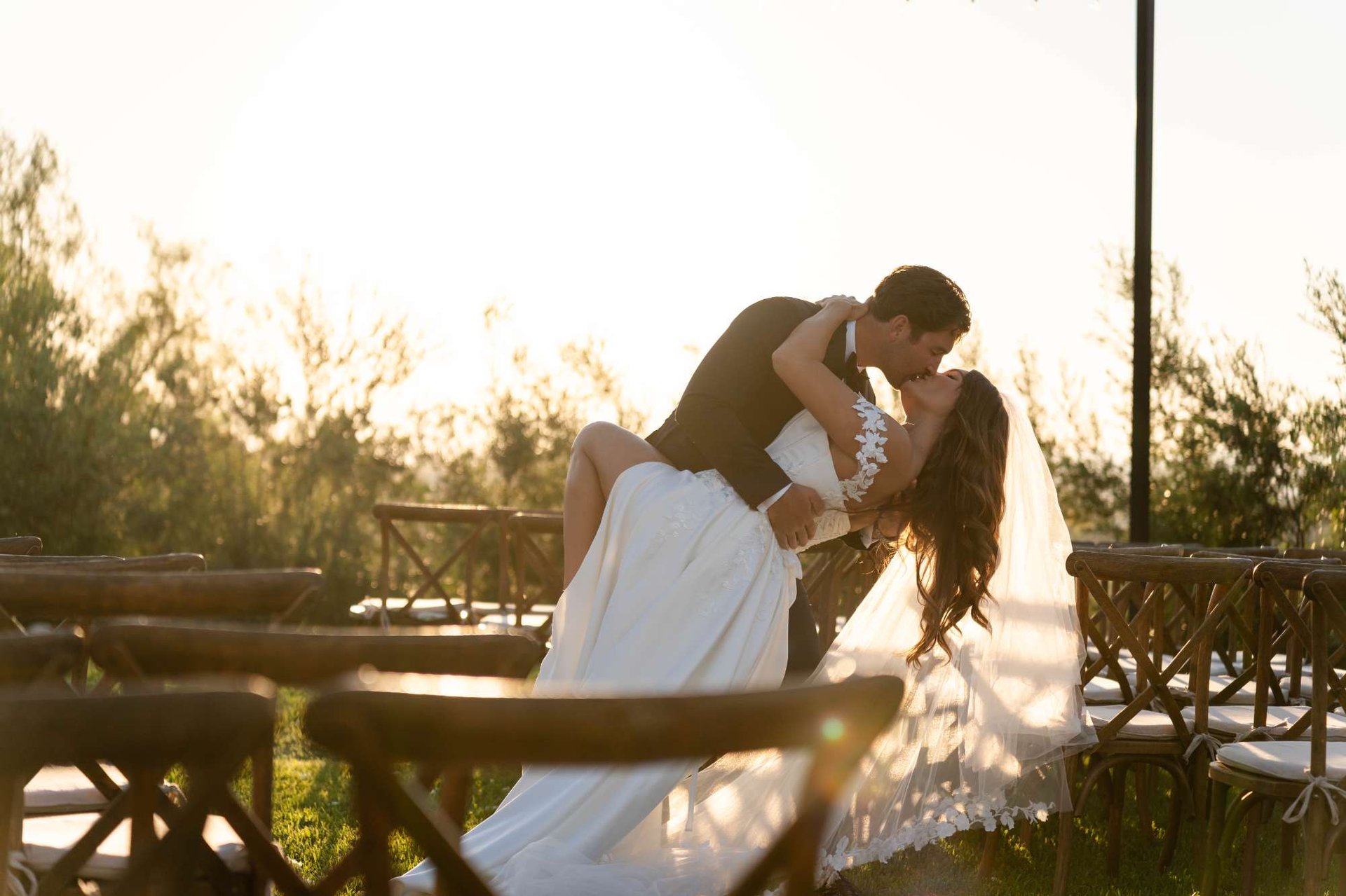 woman in white dress shirt kissing mans cheek