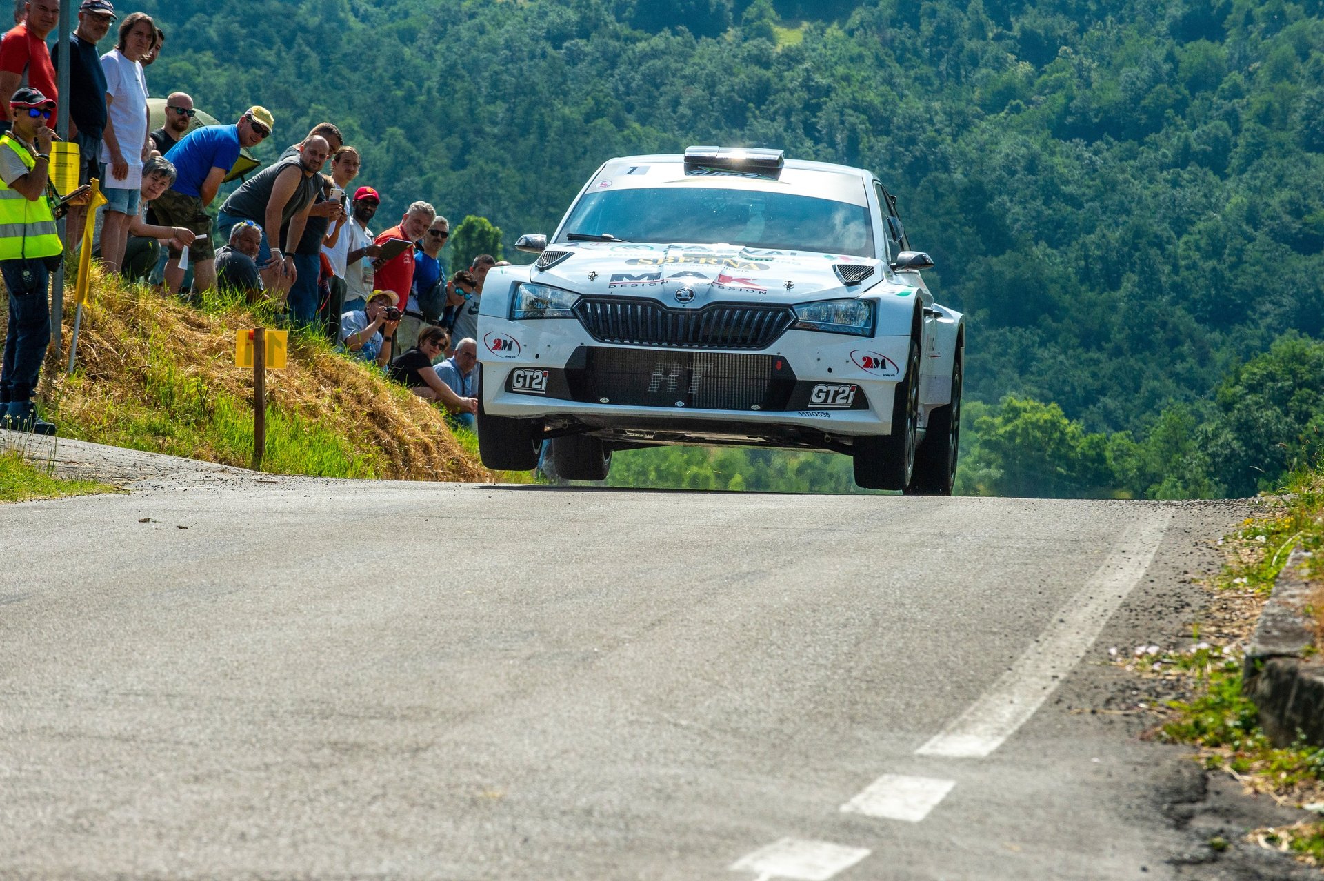 woman wearing yellow long-sleeved dress under white clouds and blue sky during daytime