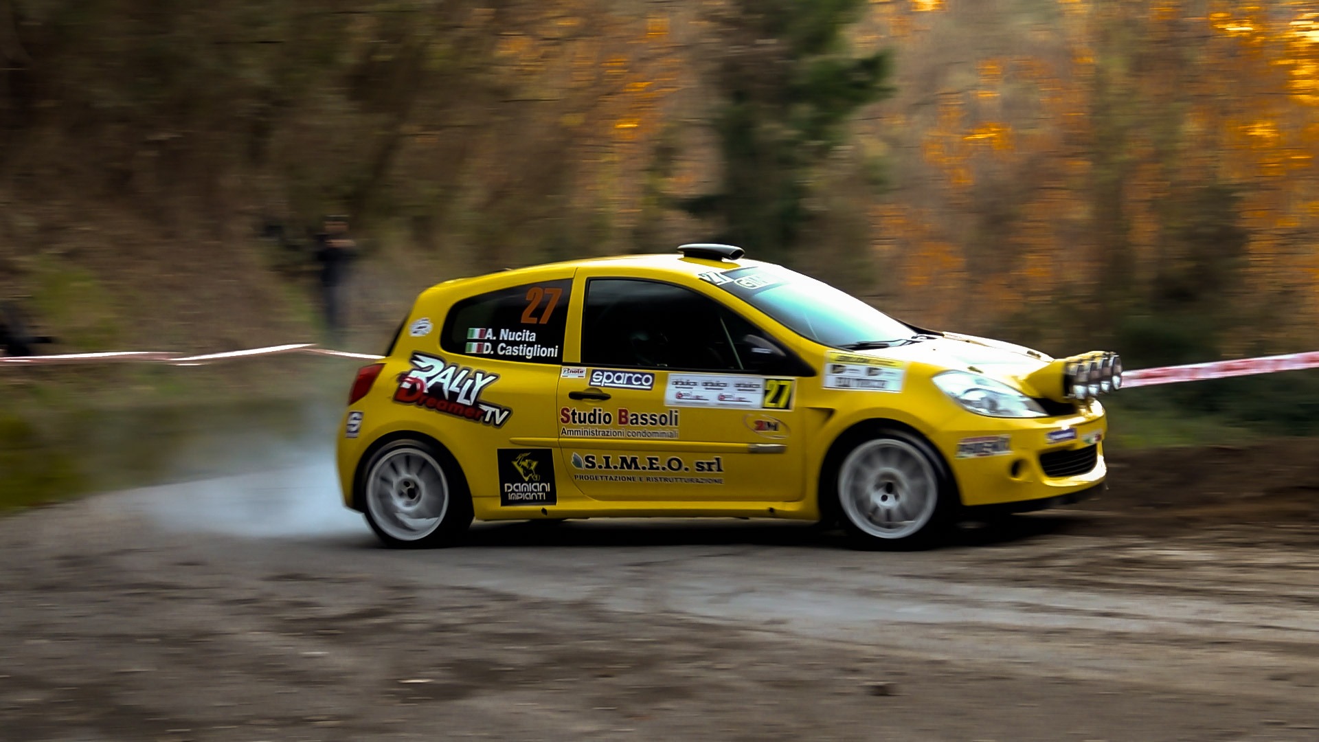 woman wearing yellow long-sleeved dress under white clouds and blue sky during daytime