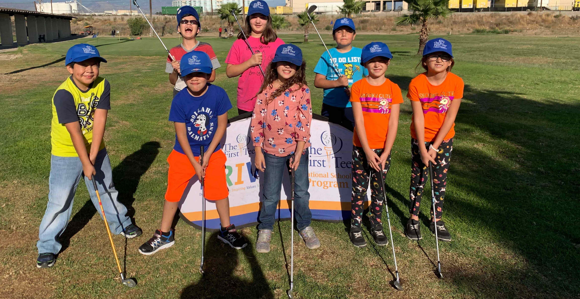 Enhancing Forward Action Inc. image of a group of youth holding golf clubs.