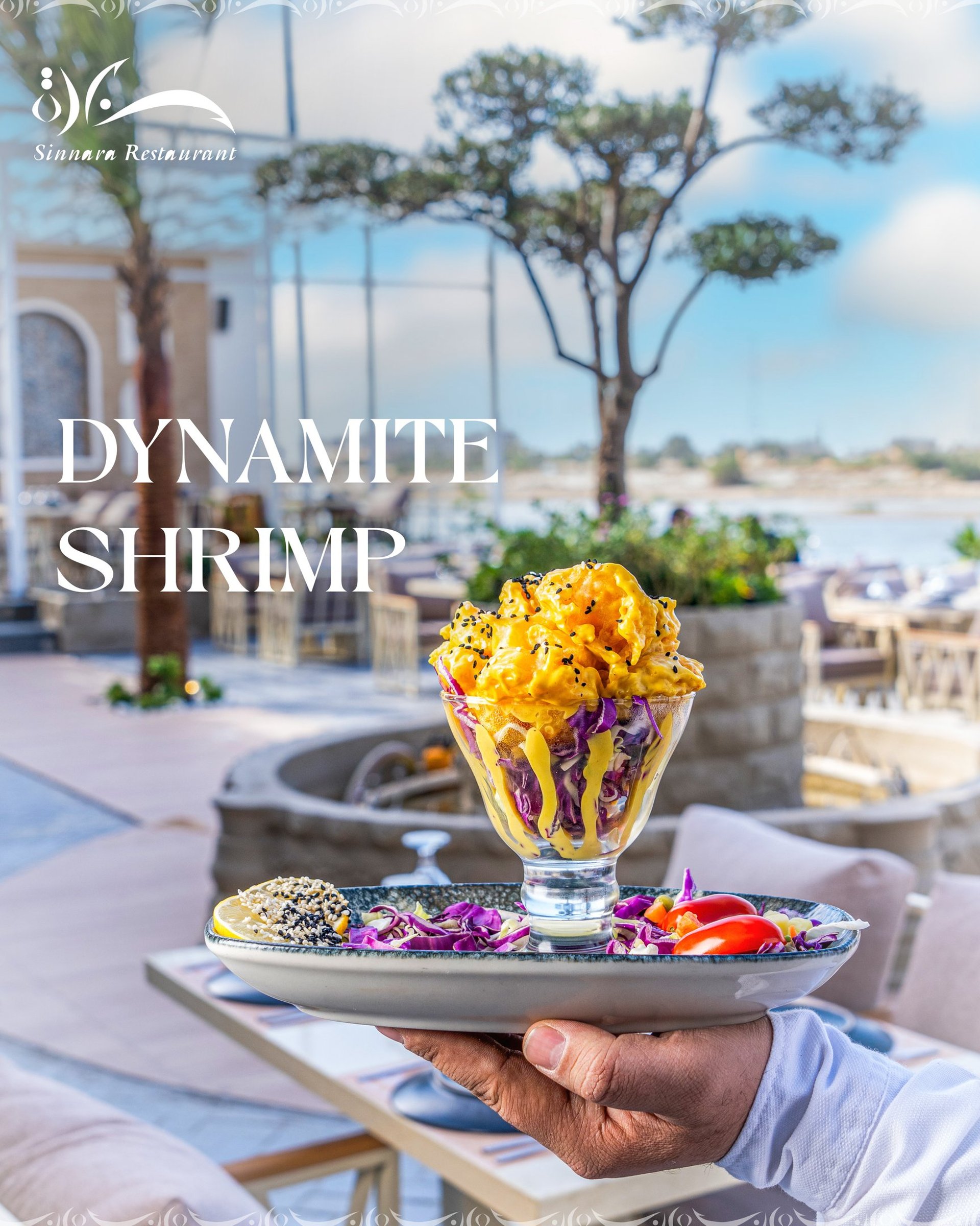 a blue bowl filled with vegetables and a wooden spoon