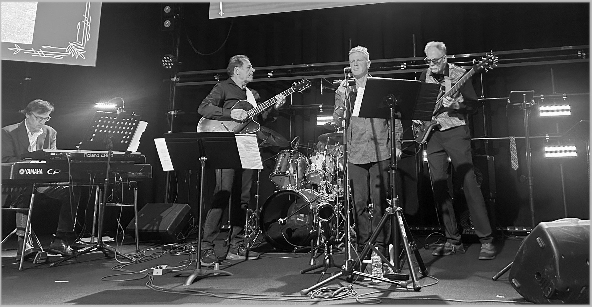 grayscale photo of people performing on street