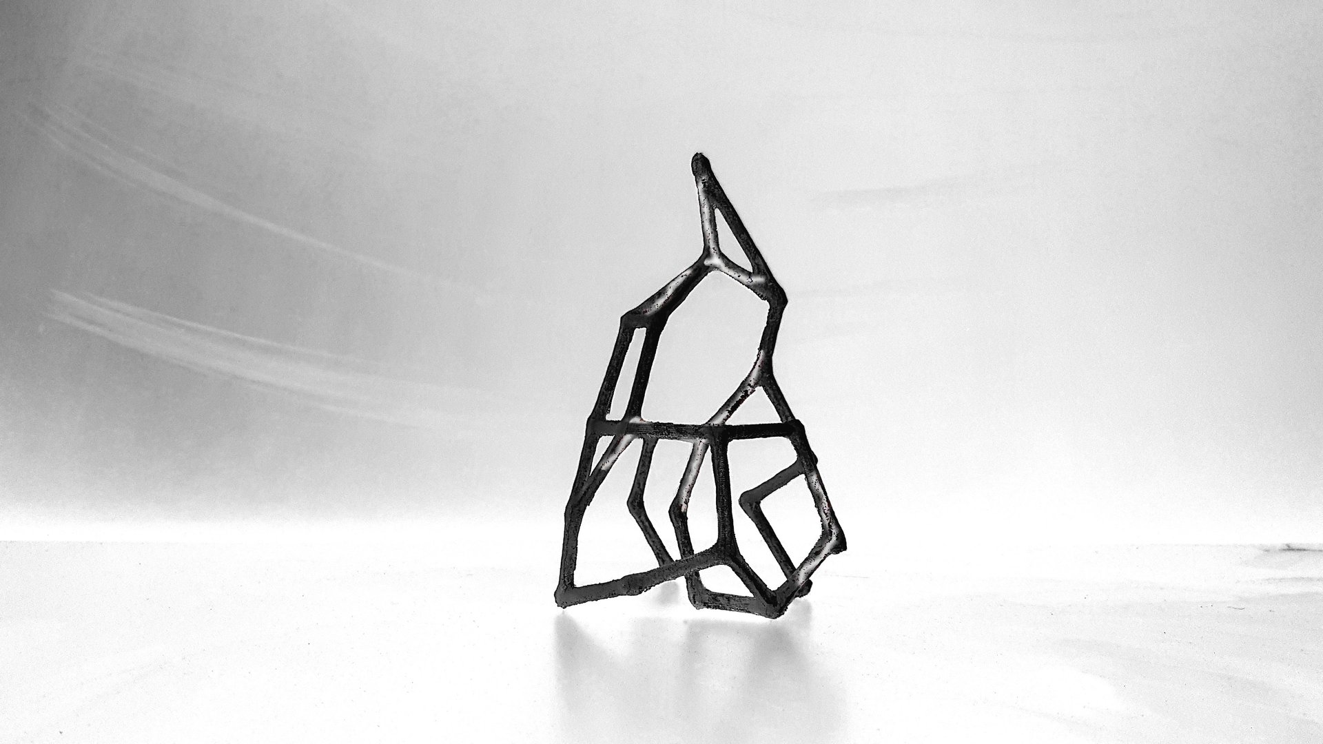 an abstract photo of a curved building with a blue sky in the background