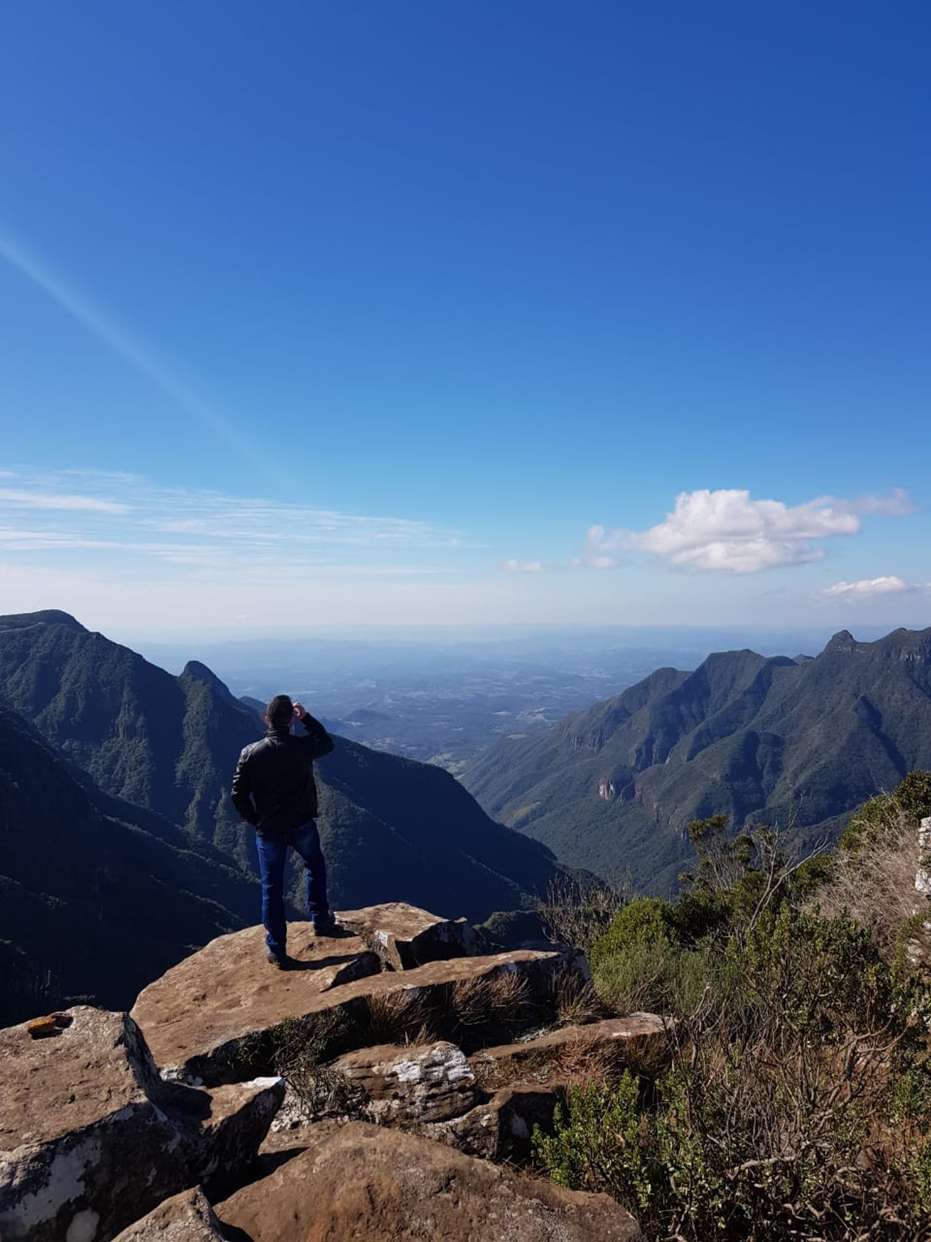 an abstract photo of a curved building with a blue sky in the background