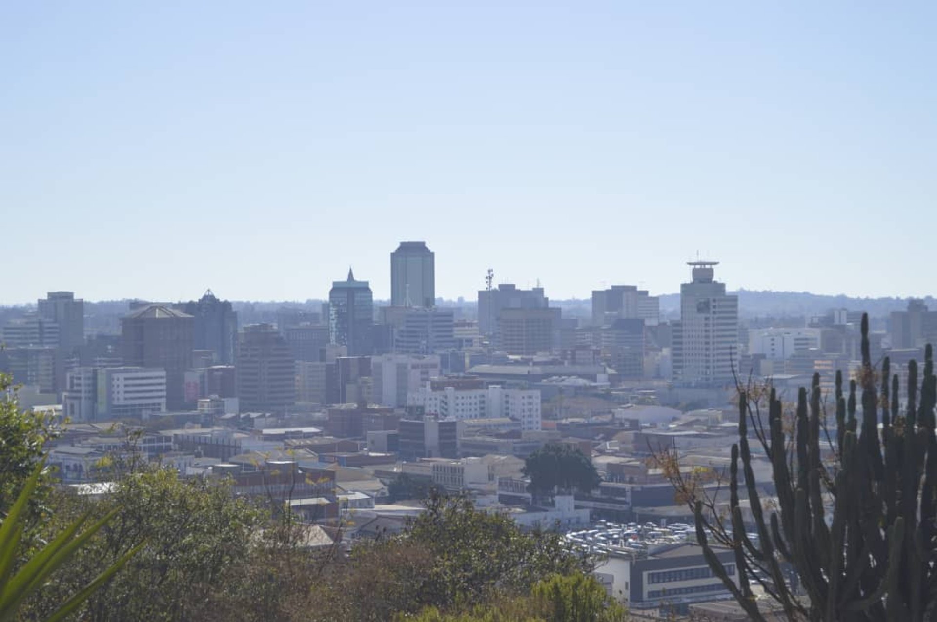 woman wearing yellow long-sleeved dress under white clouds and blue sky during daytime