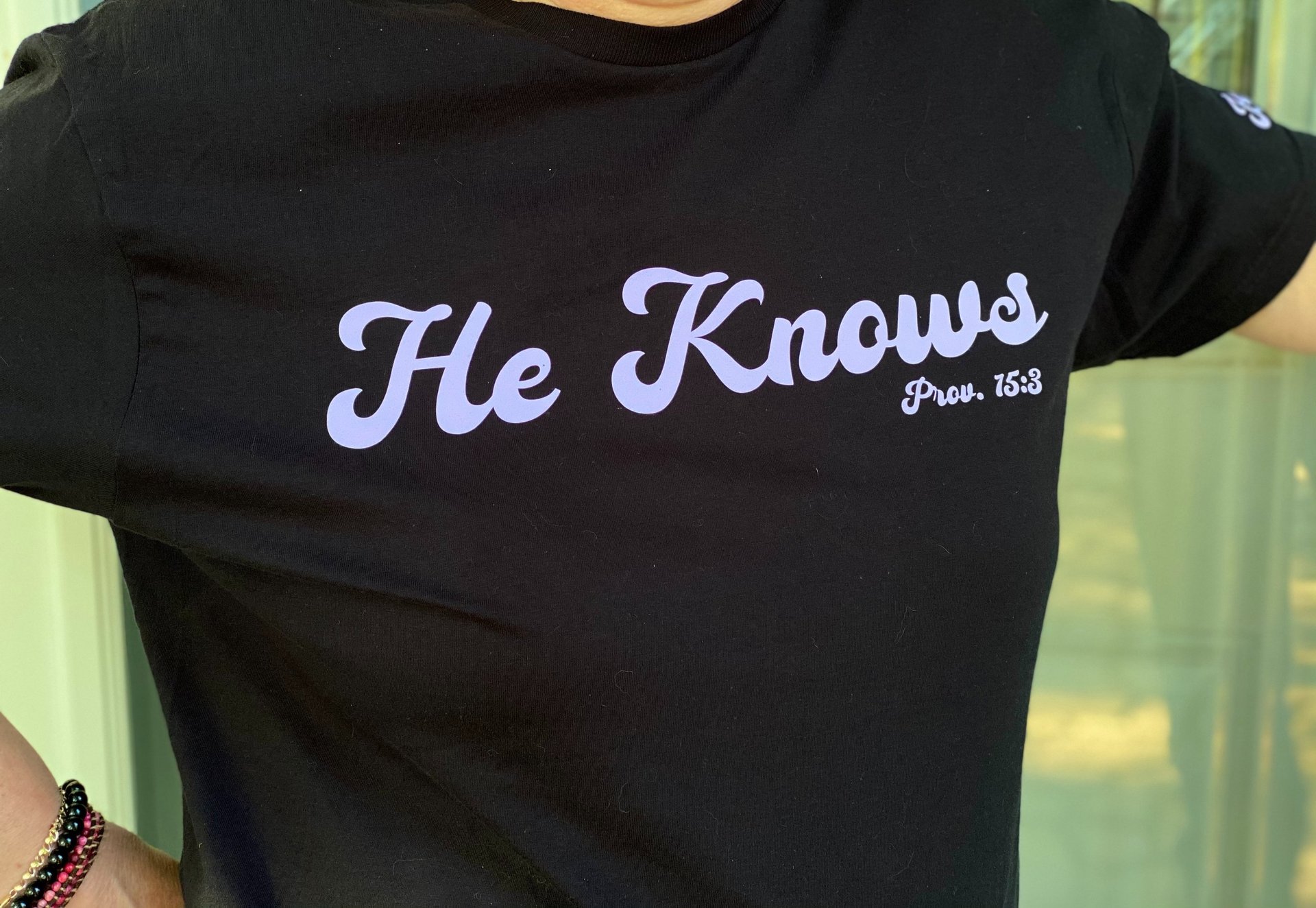 person wearing grey knit sweater