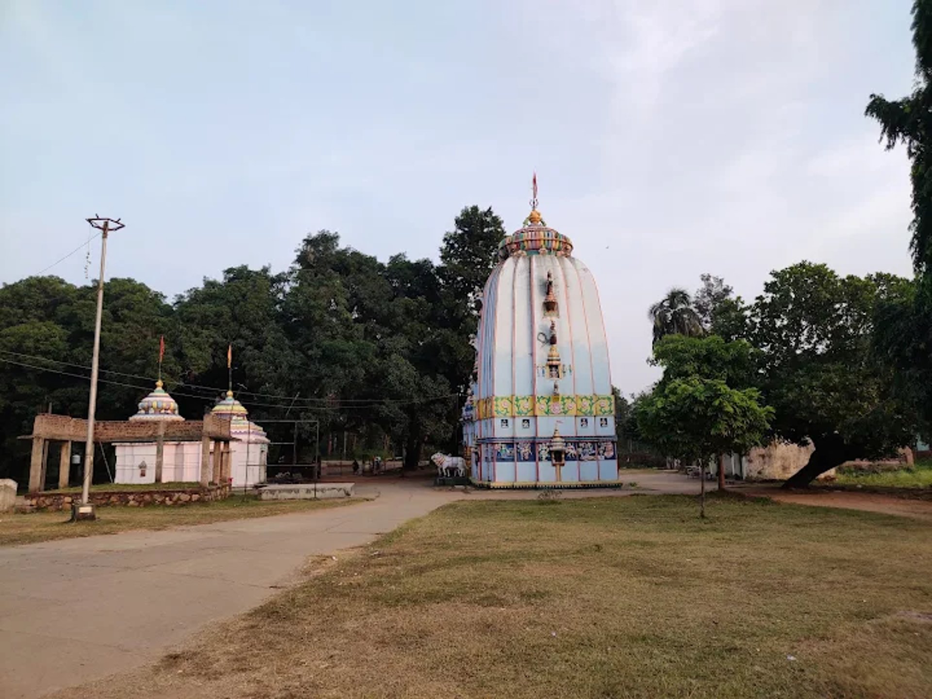 woman wearing yellow long-sleeved dress under white clouds and blue sky during daytime