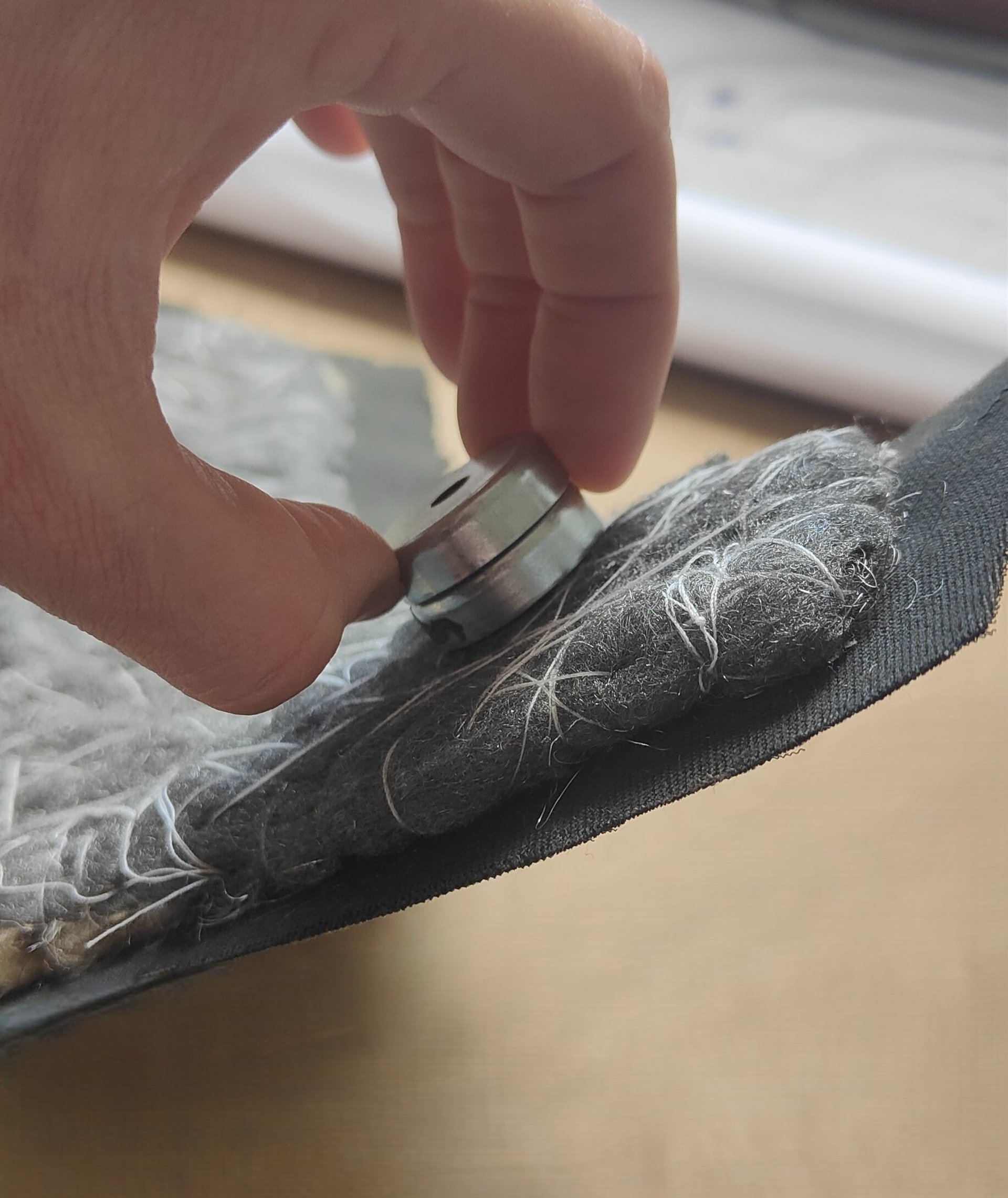 an abstract photo of a curved building with a blue sky in the background