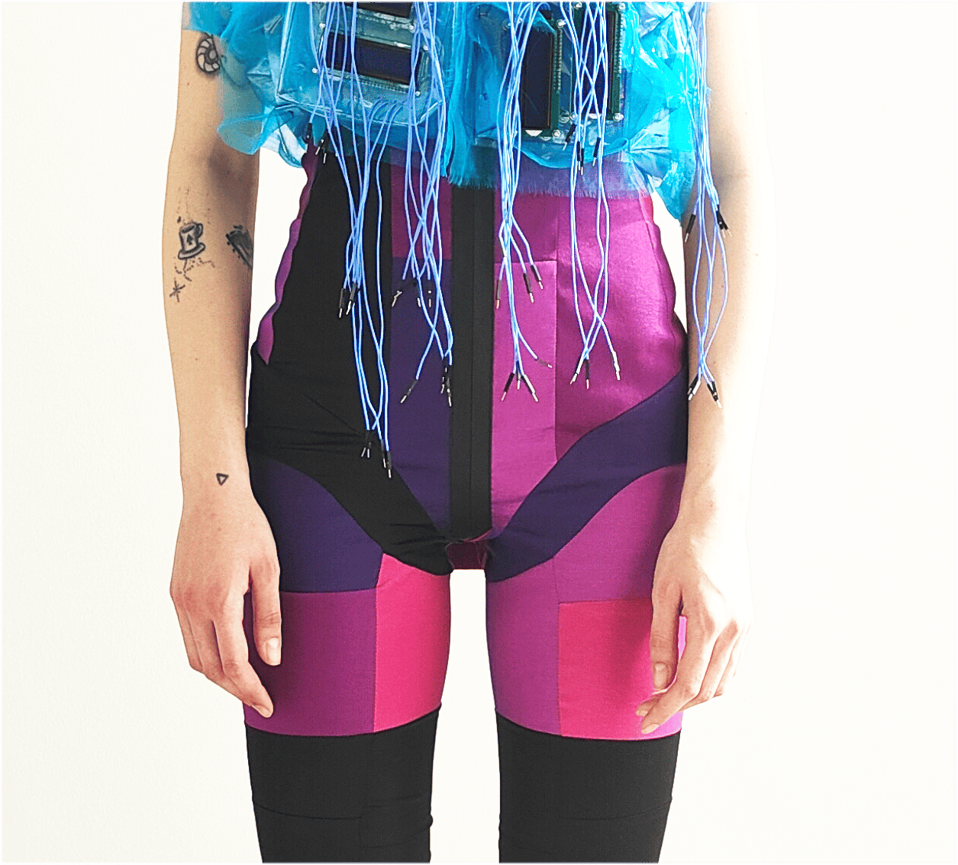 an abstract photo of a curved building with a blue sky in the background