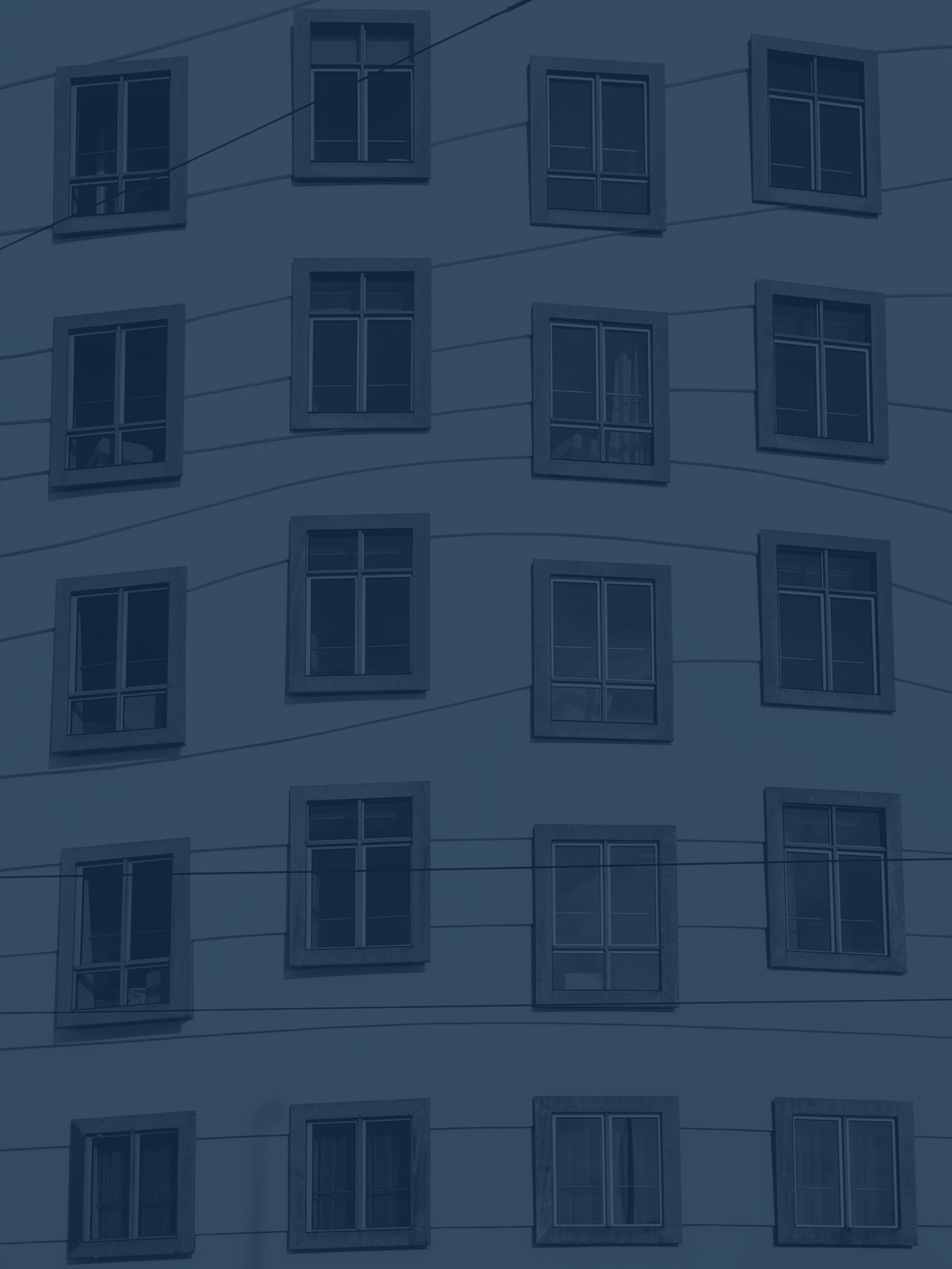 grayscale photo of buildings windows
