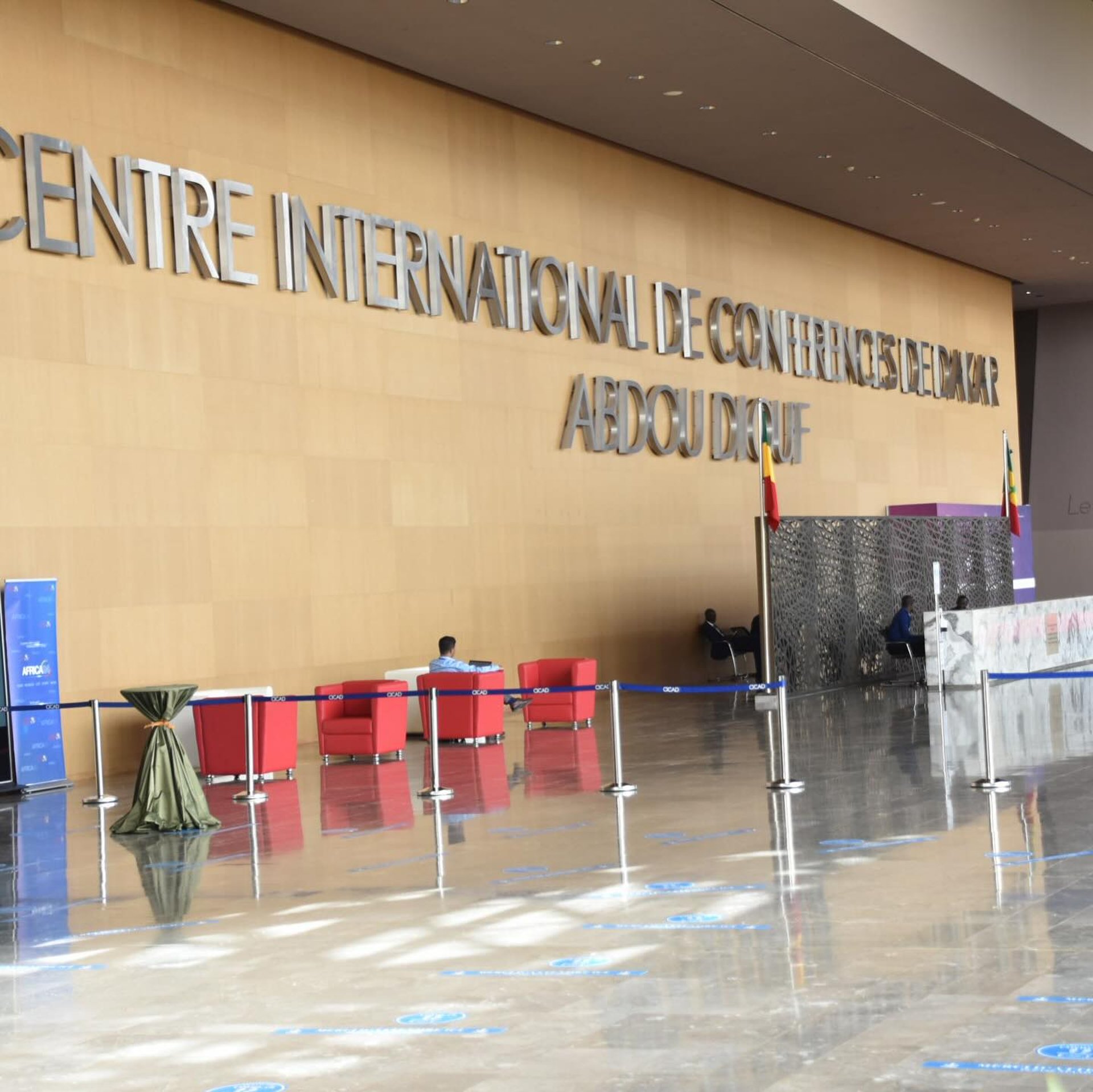 an abstract photo of a curved building with a blue sky in the background