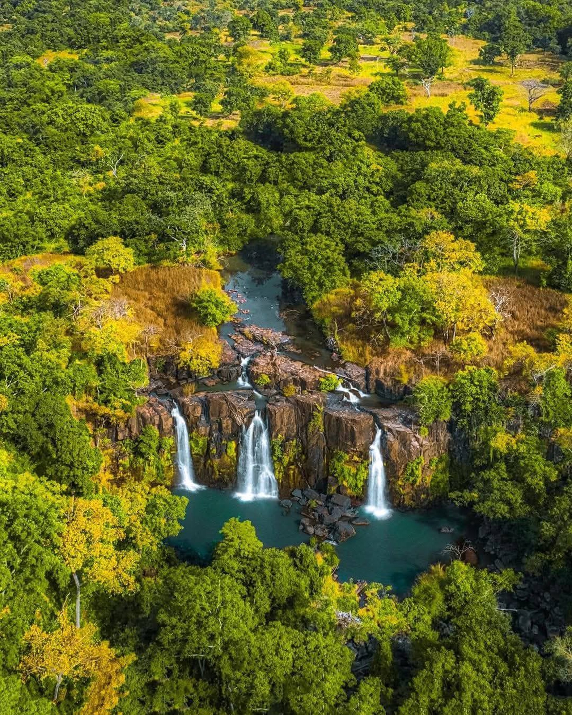 an abstract photo of a curved building with a blue sky in the background