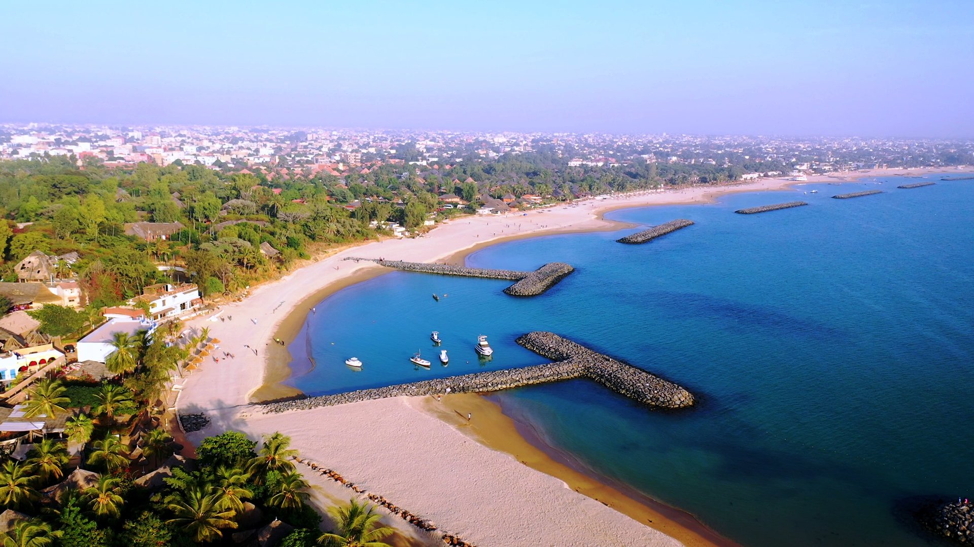 an abstract photo of a curved building with a blue sky in the background