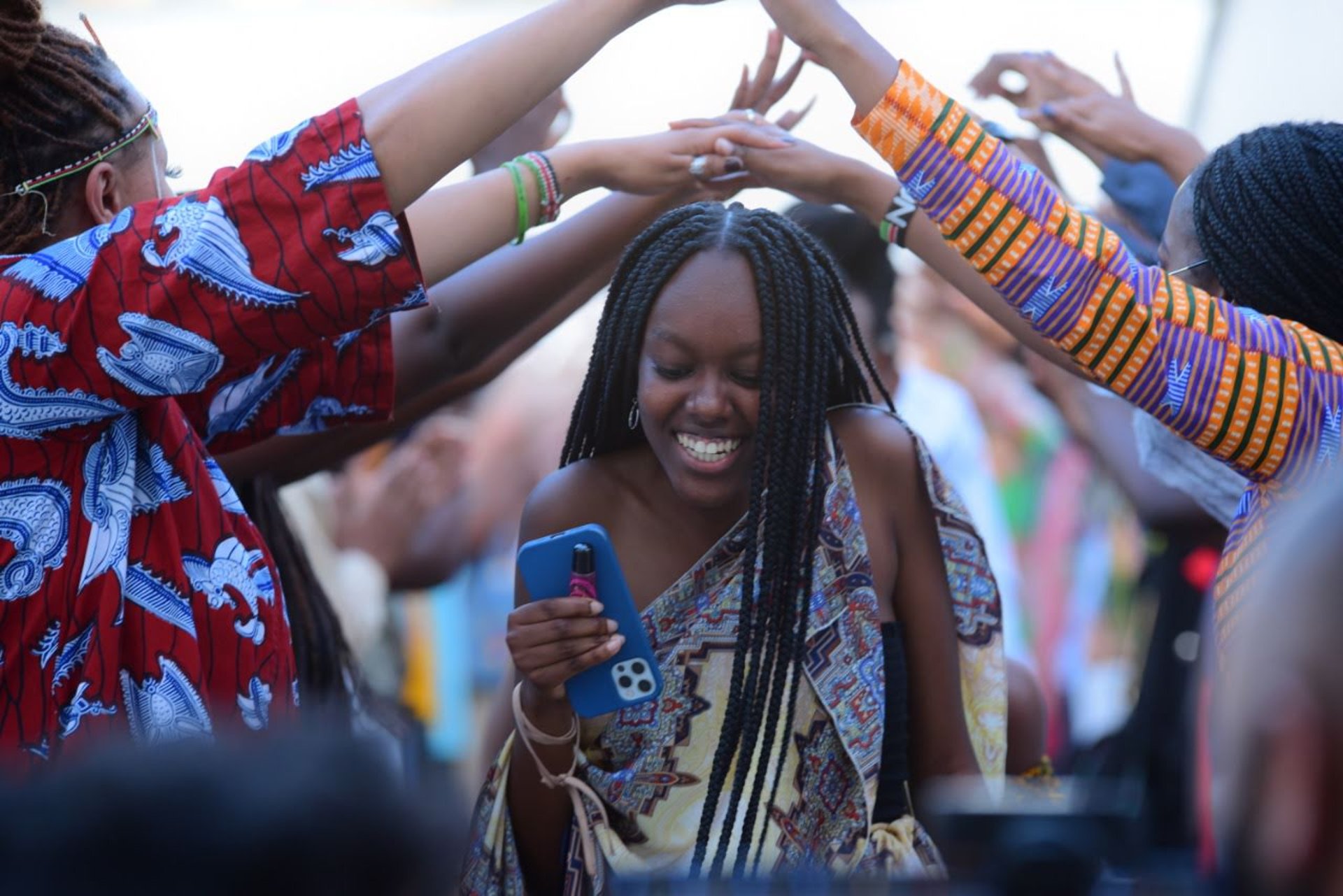 Team brainstorming with colorful sticky notes on glass.