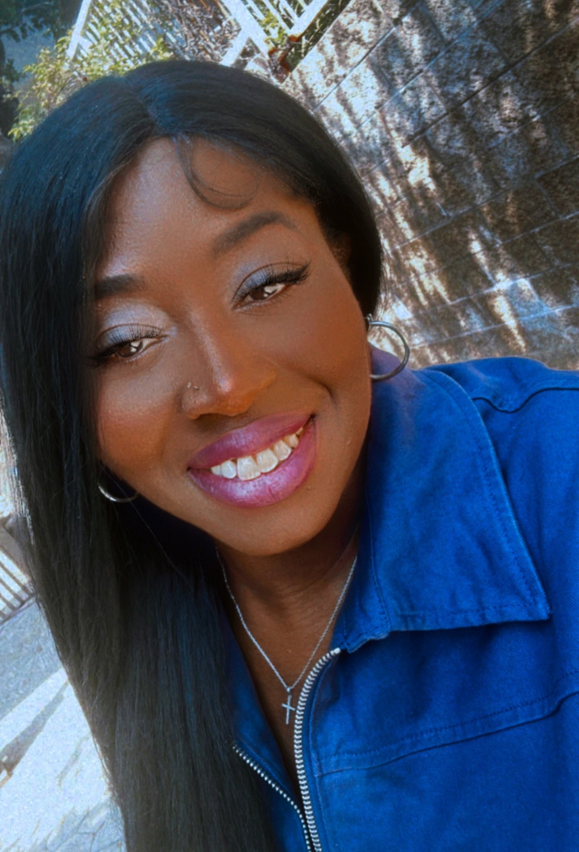 People are watching a concert with stage lights.