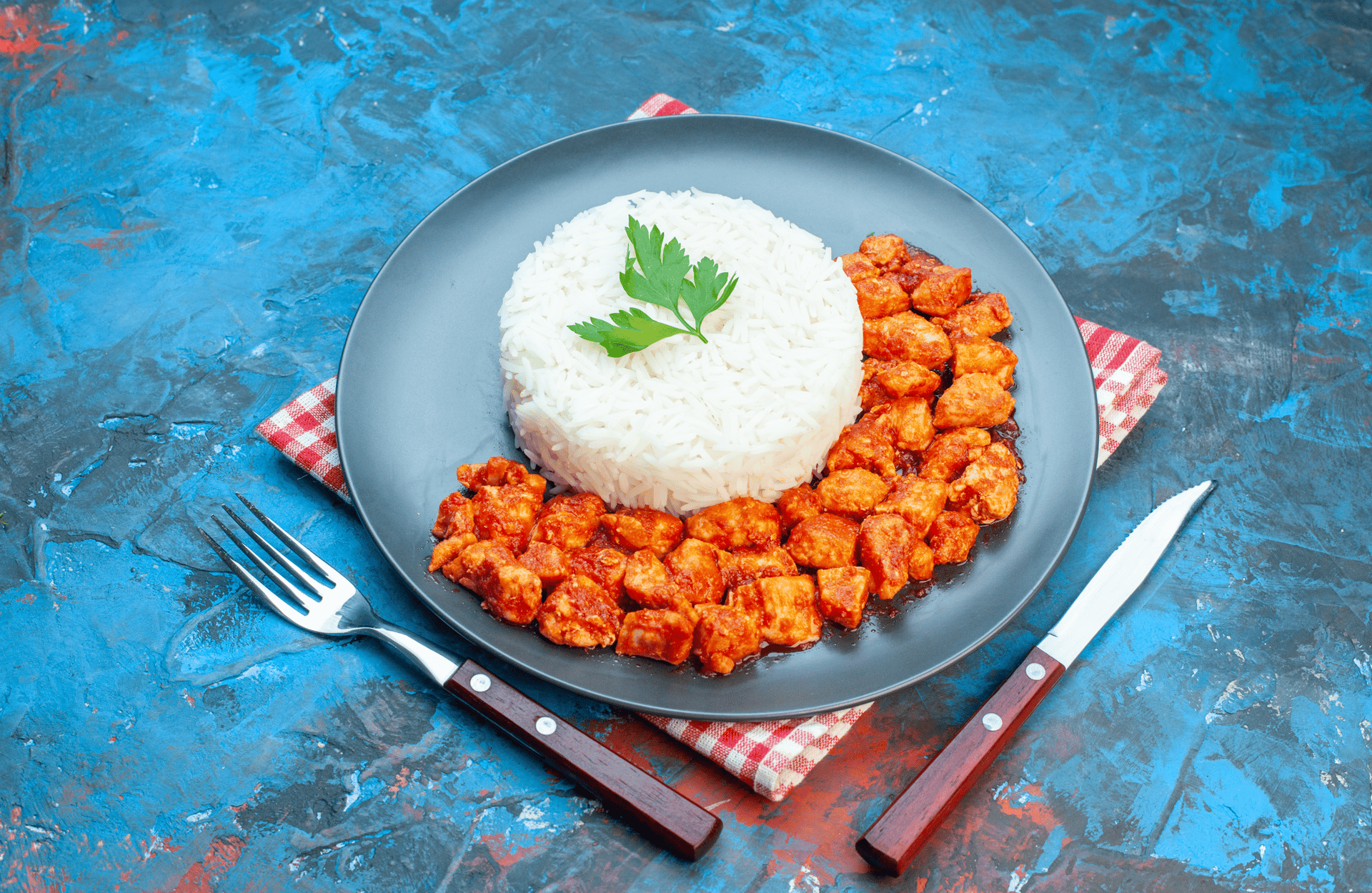 a bowl filled with rice and meat on top of a table