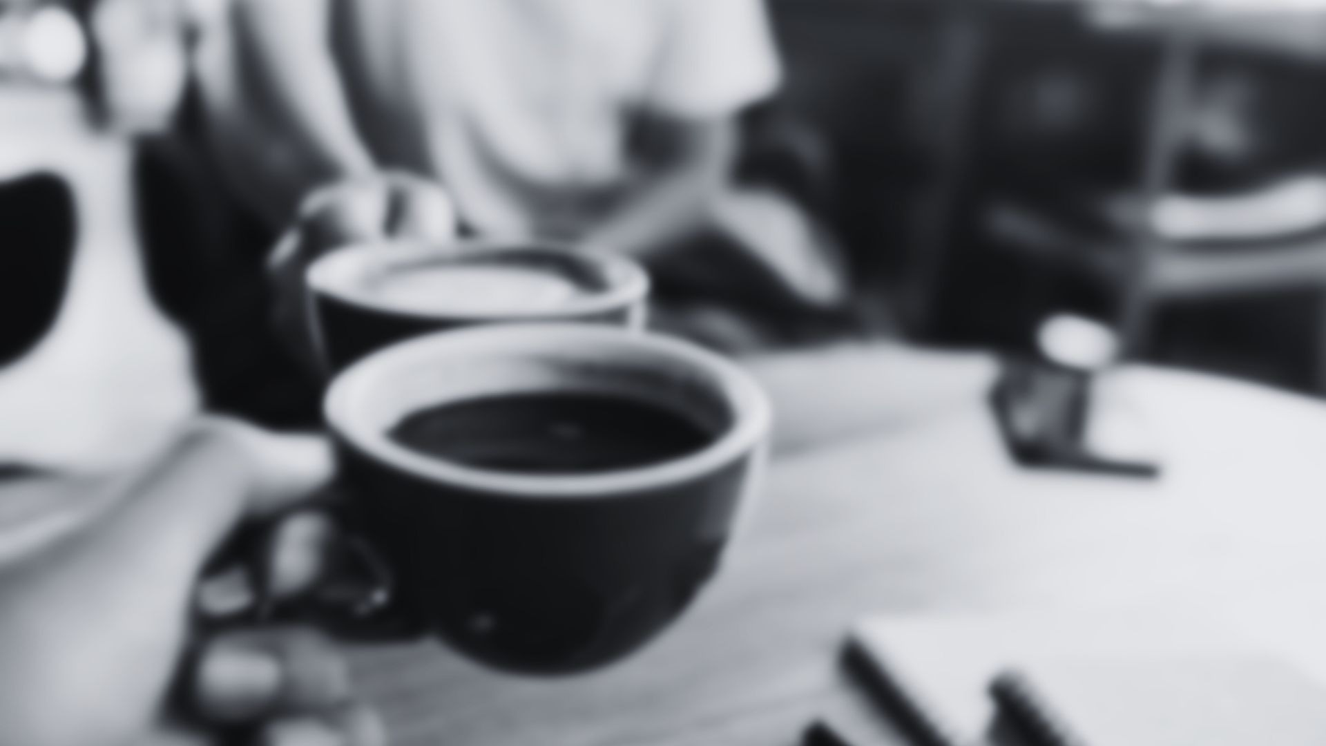 person holding two tea cups