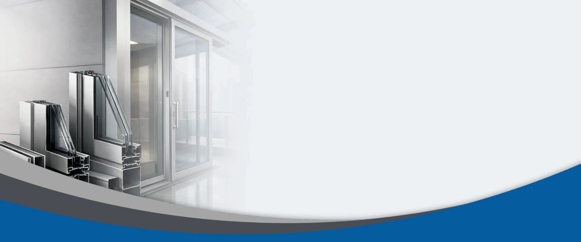 A workshop scene featuring stacks of aluminum frames in various sizes, with work tables and tools in the background.