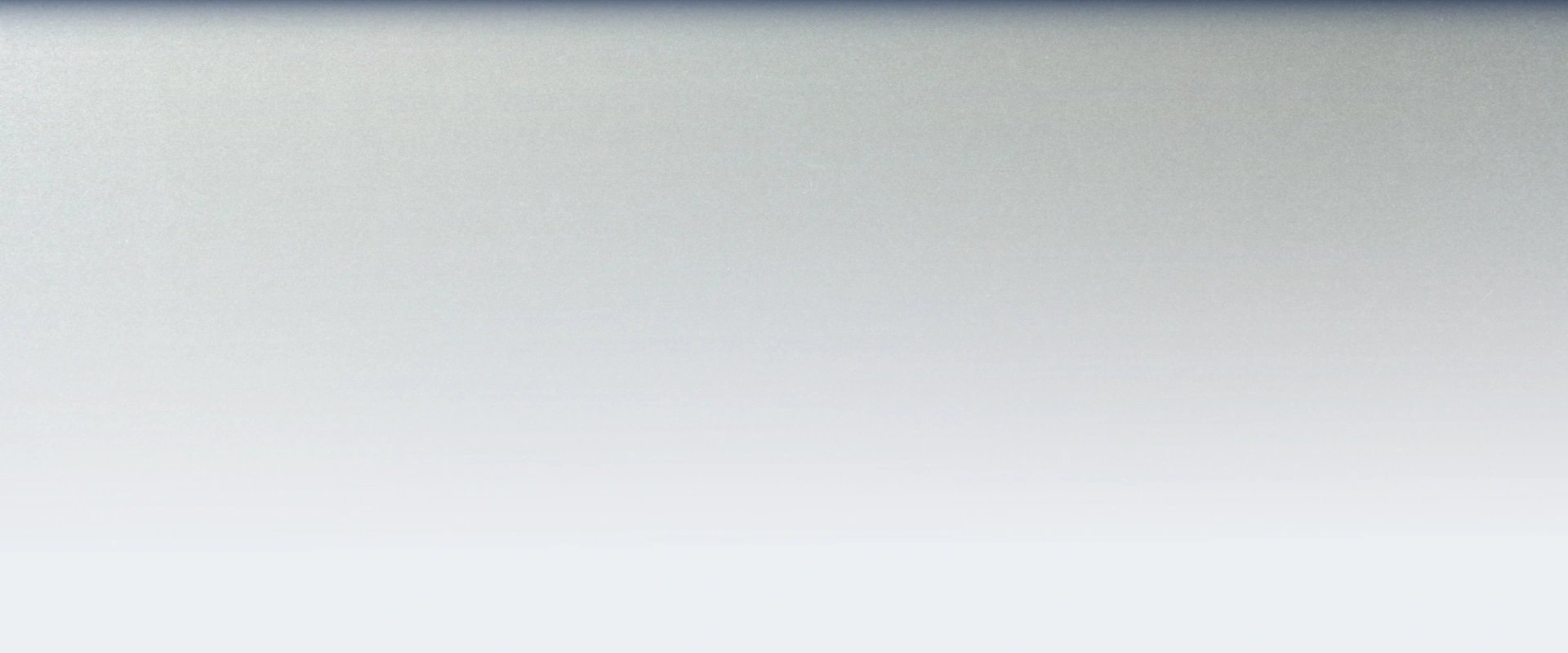 Bright, modern office corridor with glass walls and doors, featuring polished marble floors and minimalistic design elements.