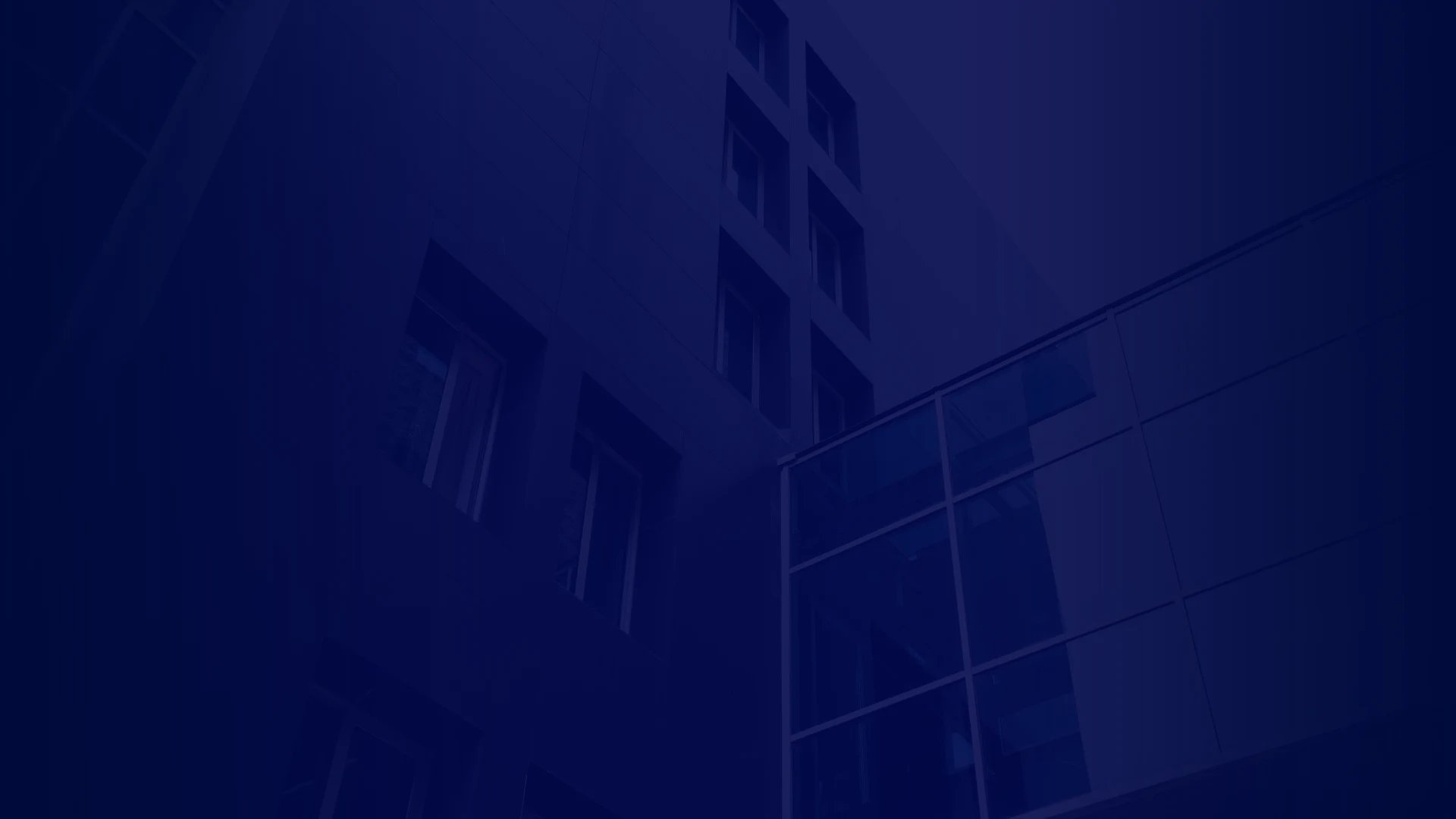 A modern building with sleek glass design and geometric features, overlaid by the name "MEEGAN" on a dark gradient background