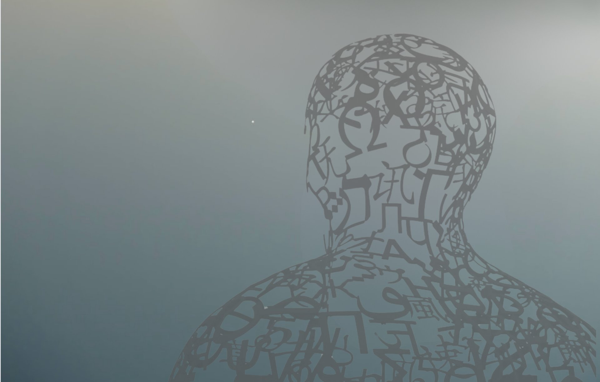 a sculpture of a man with letters all over it