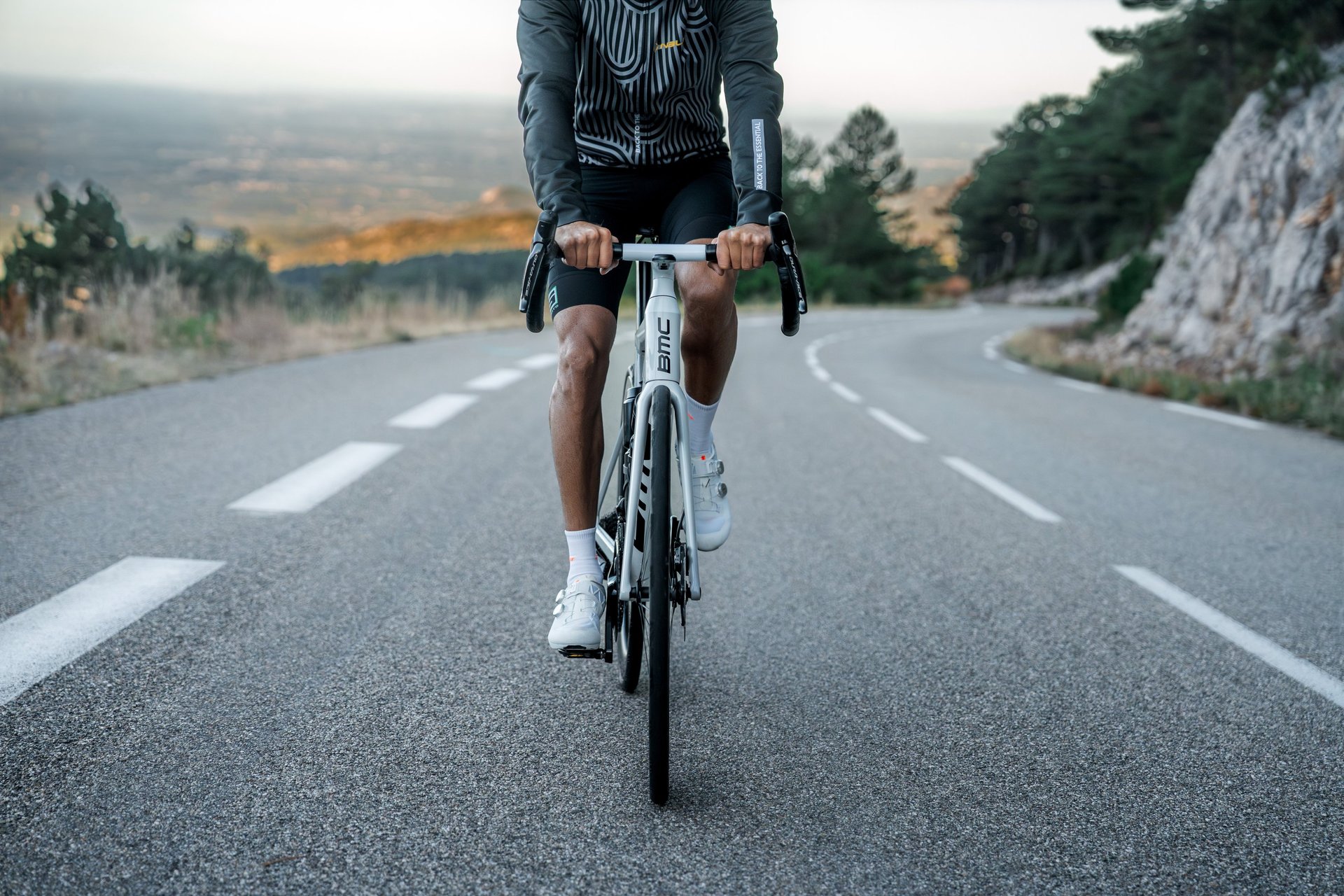 an abstract photo of a curved building with a blue sky in the background