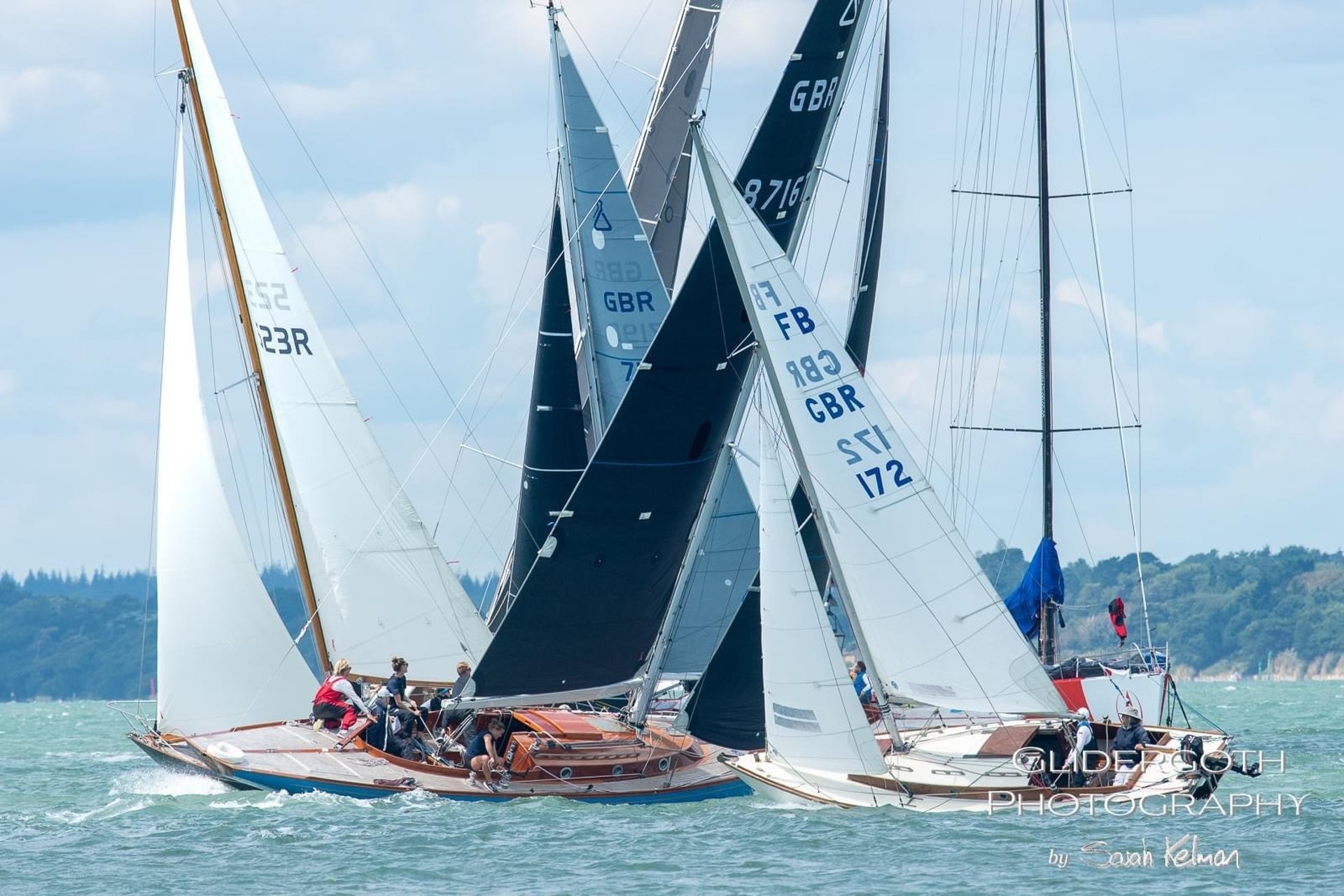 woman wearing yellow long-sleeved dress under white clouds and blue sky during daytime