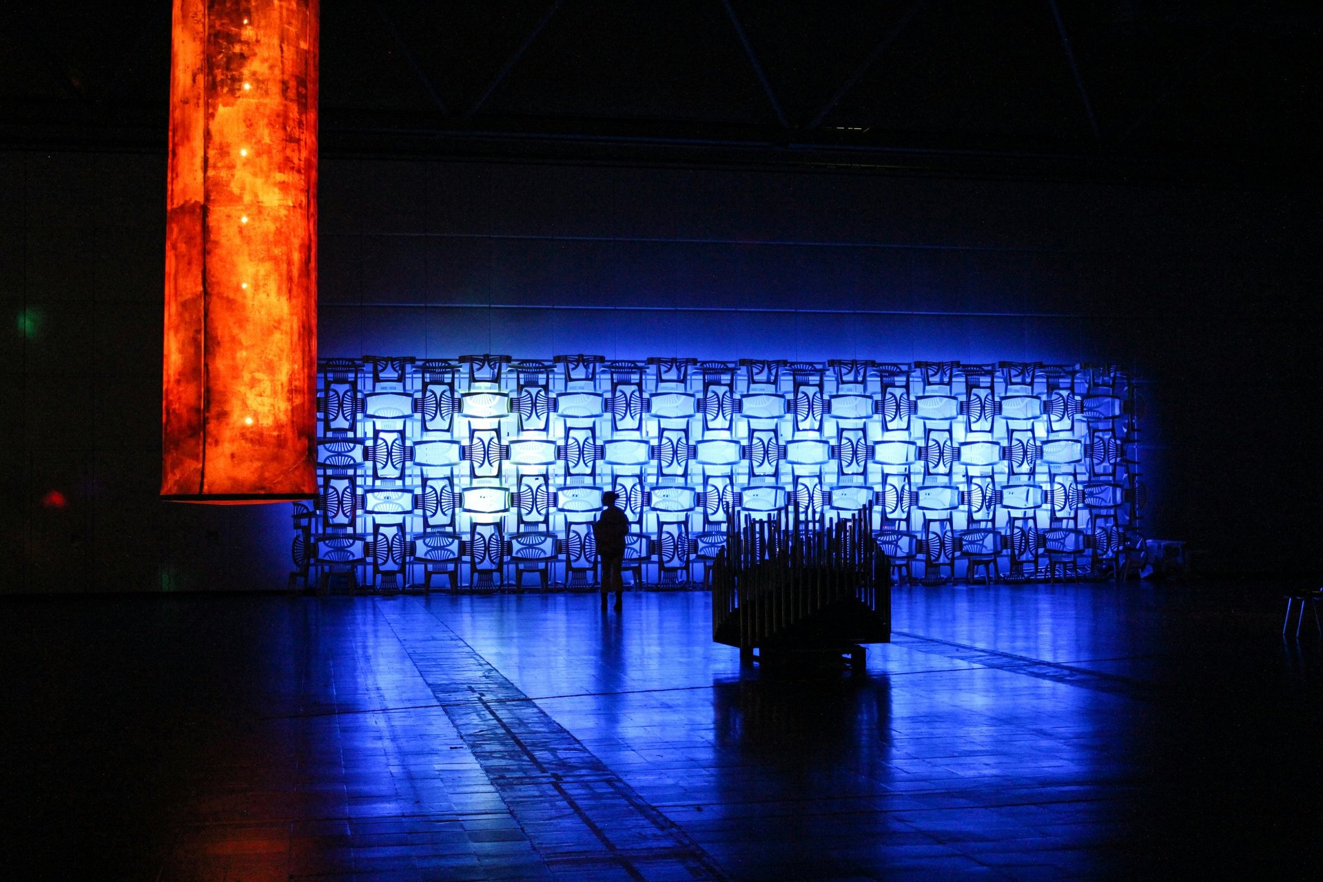 a group of people standing in a dark room