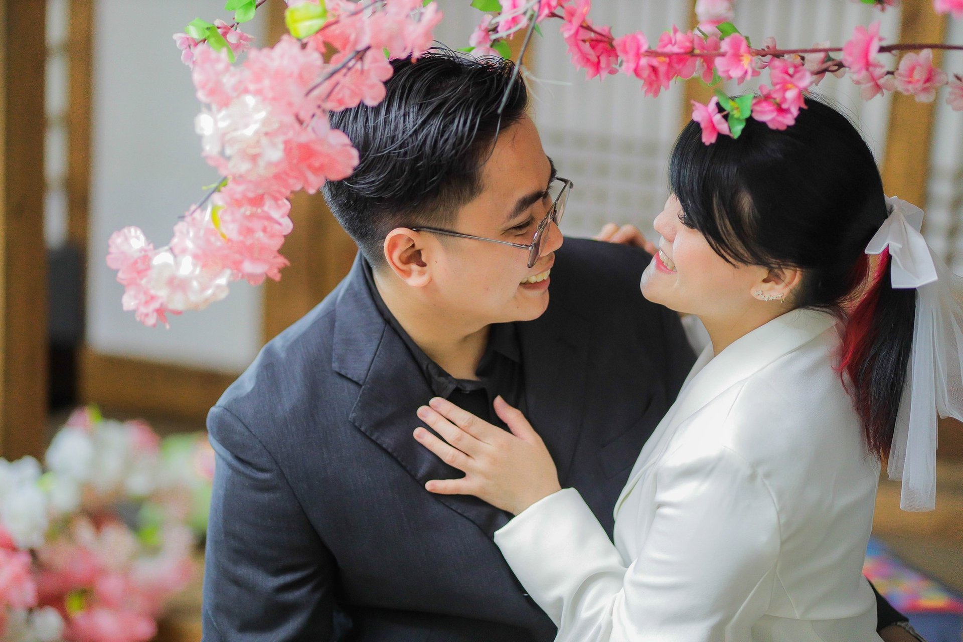 couple wearing silver-colored rings