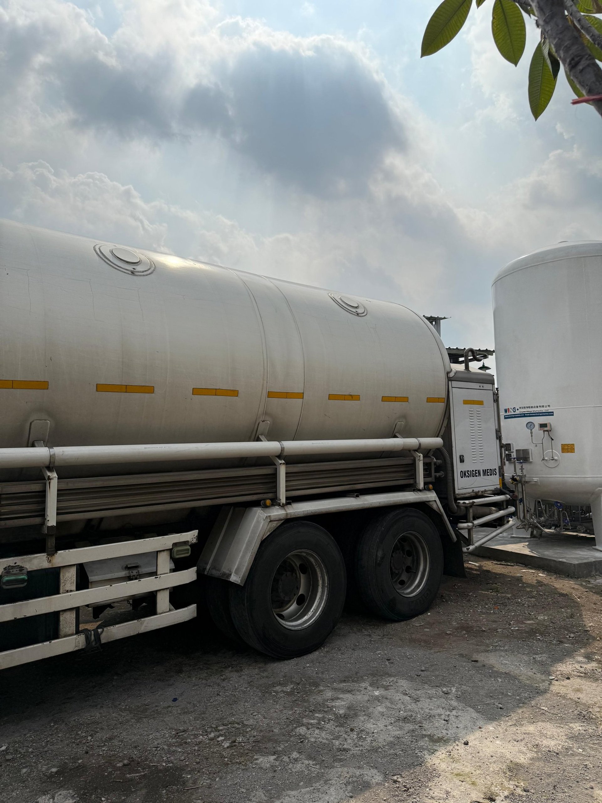 woman wearing yellow long-sleeved dress under white clouds and blue sky during daytime
