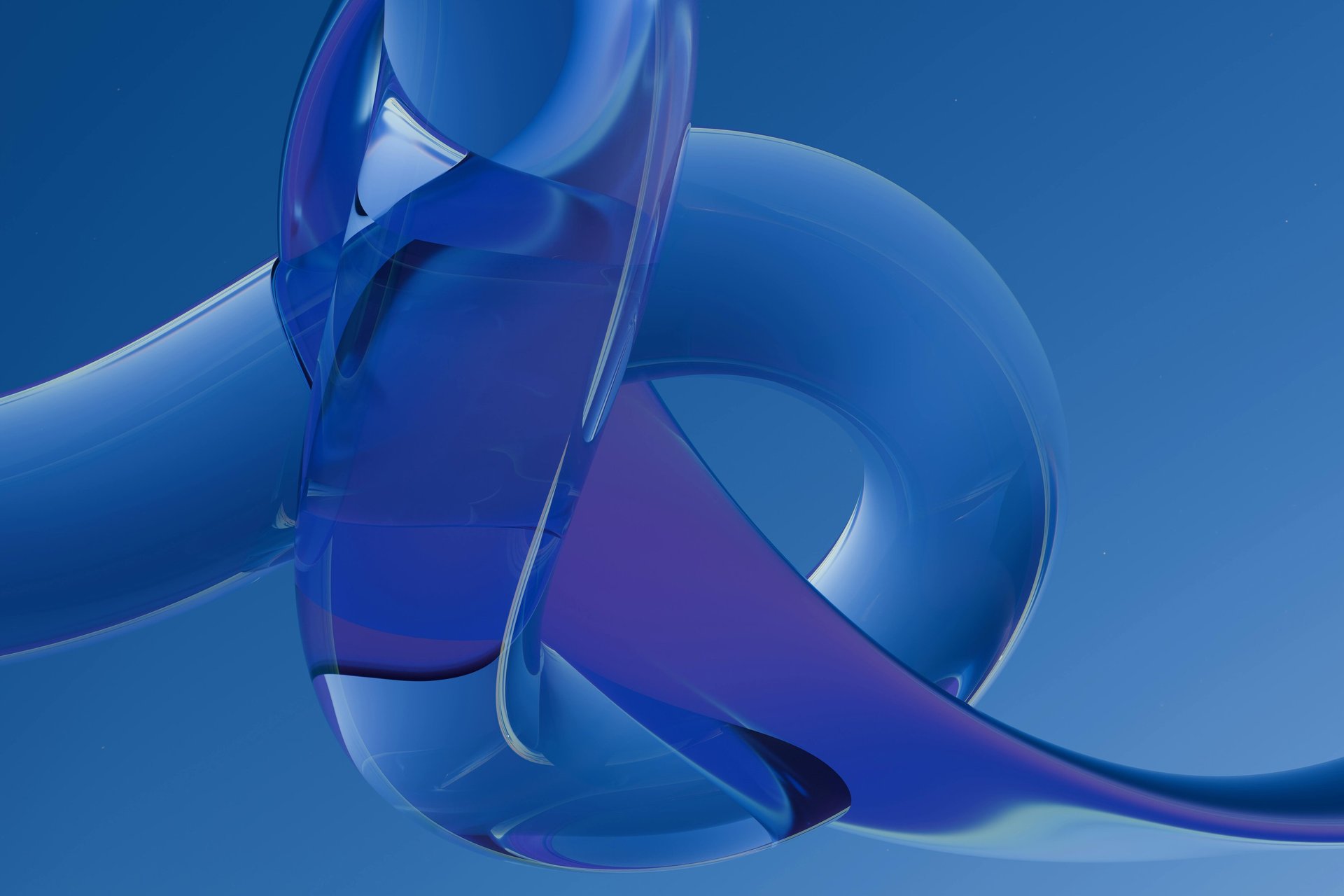 an abstract photo of a curved building with a blue sky in the background