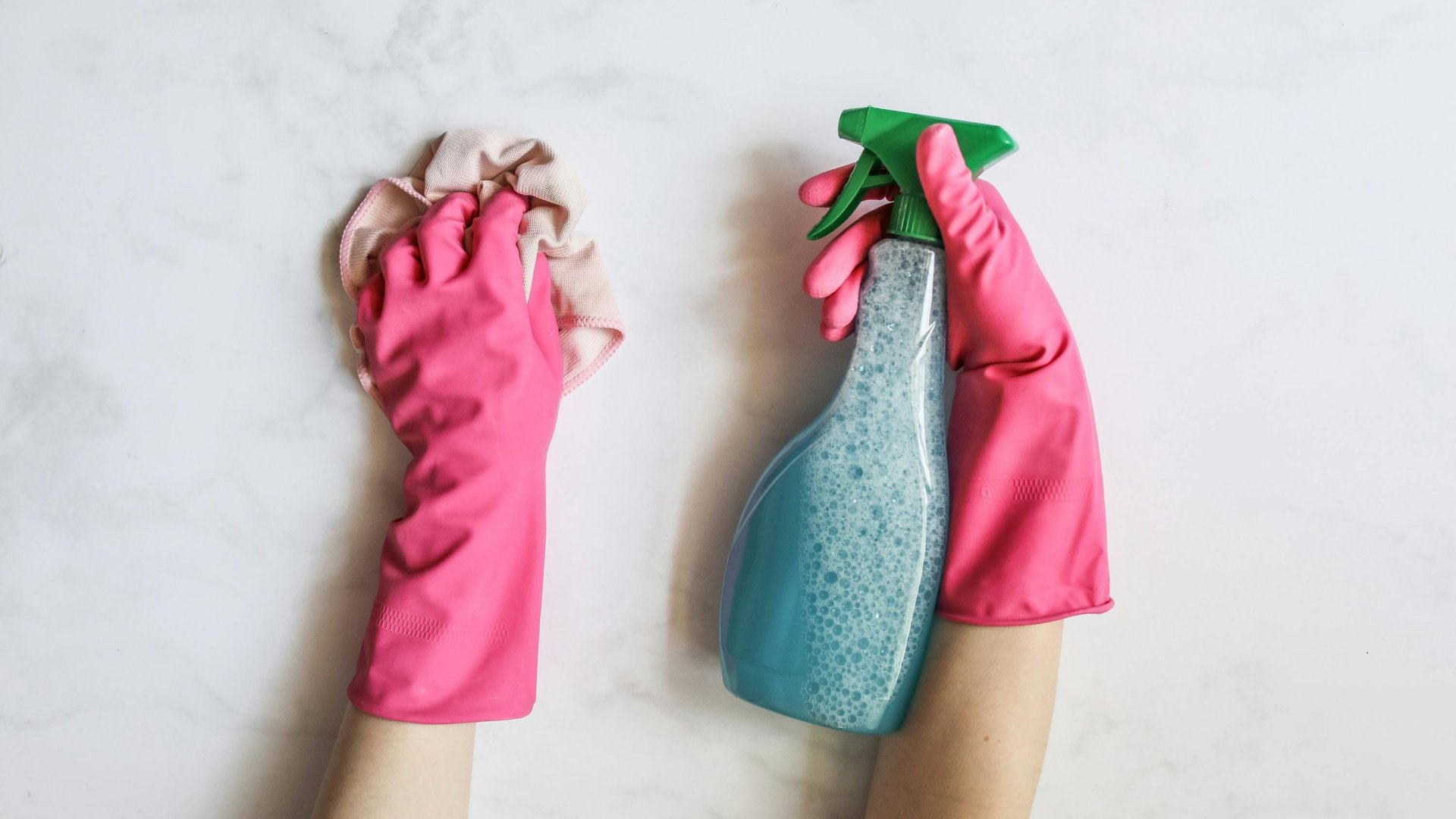 person in blue long sleeve shirt sitting beside black laptop computer
