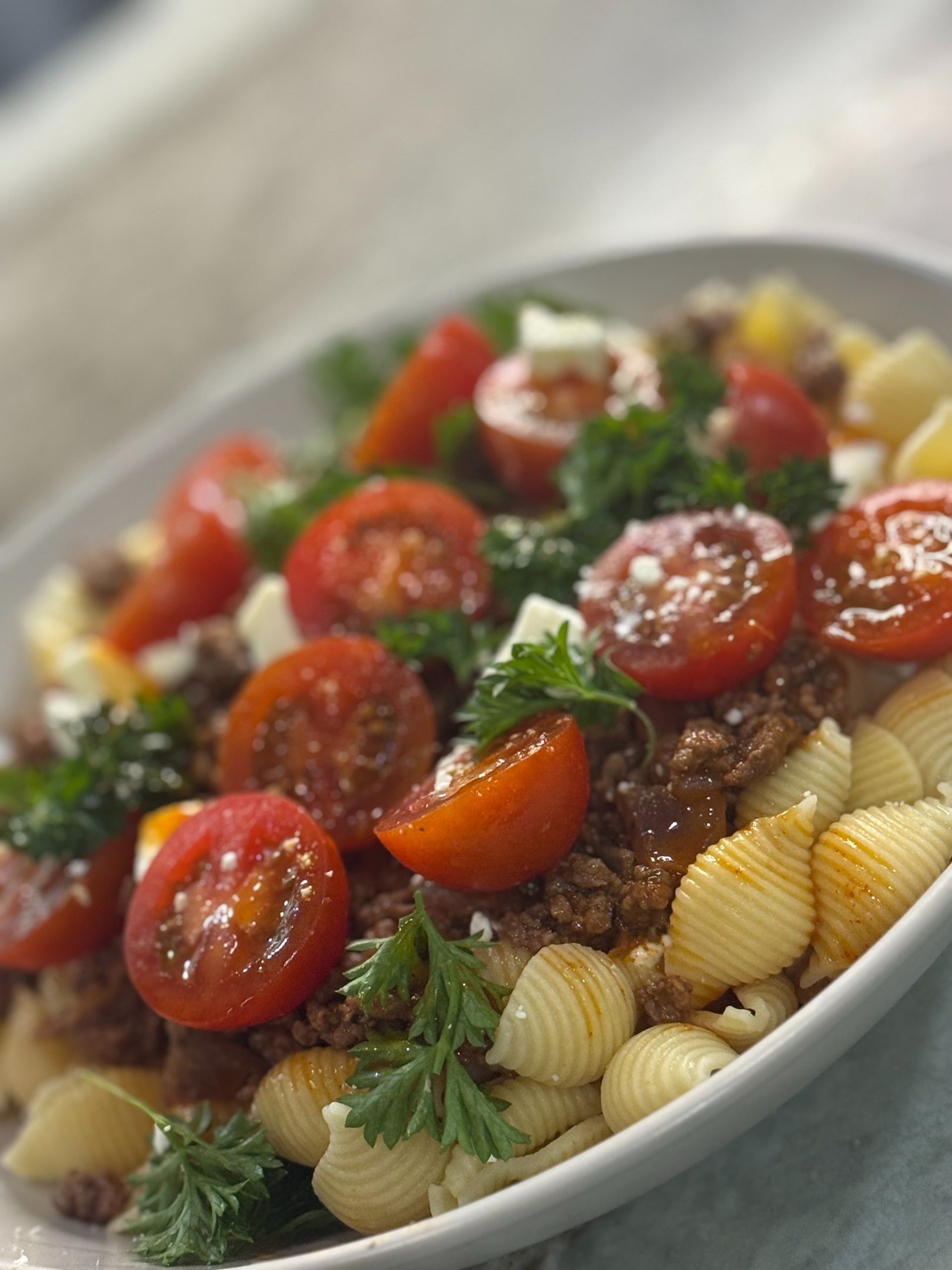 an abstract photo of a curved building with a blue sky in the background