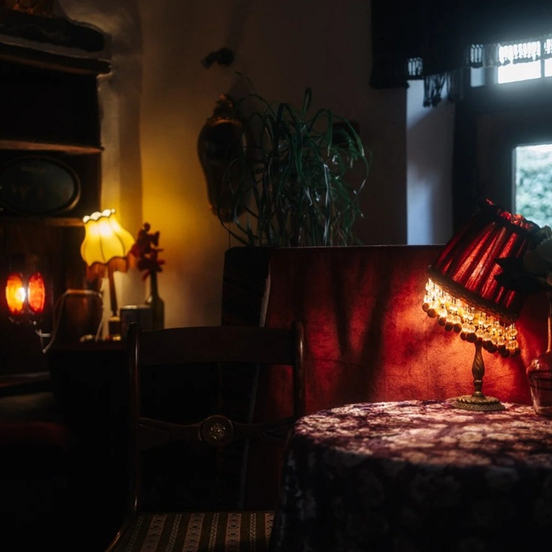 black concrete road surrounded by brown rocks