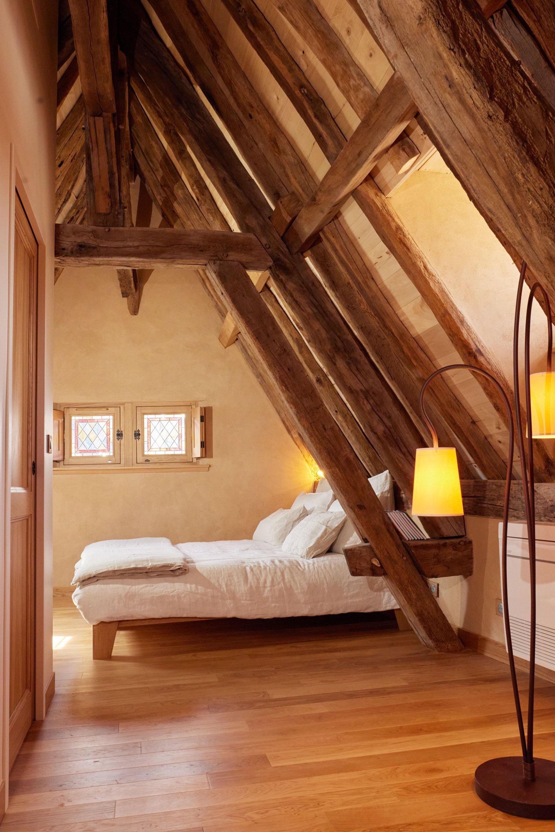 an abstract photo of a curved building with a blue sky in the background