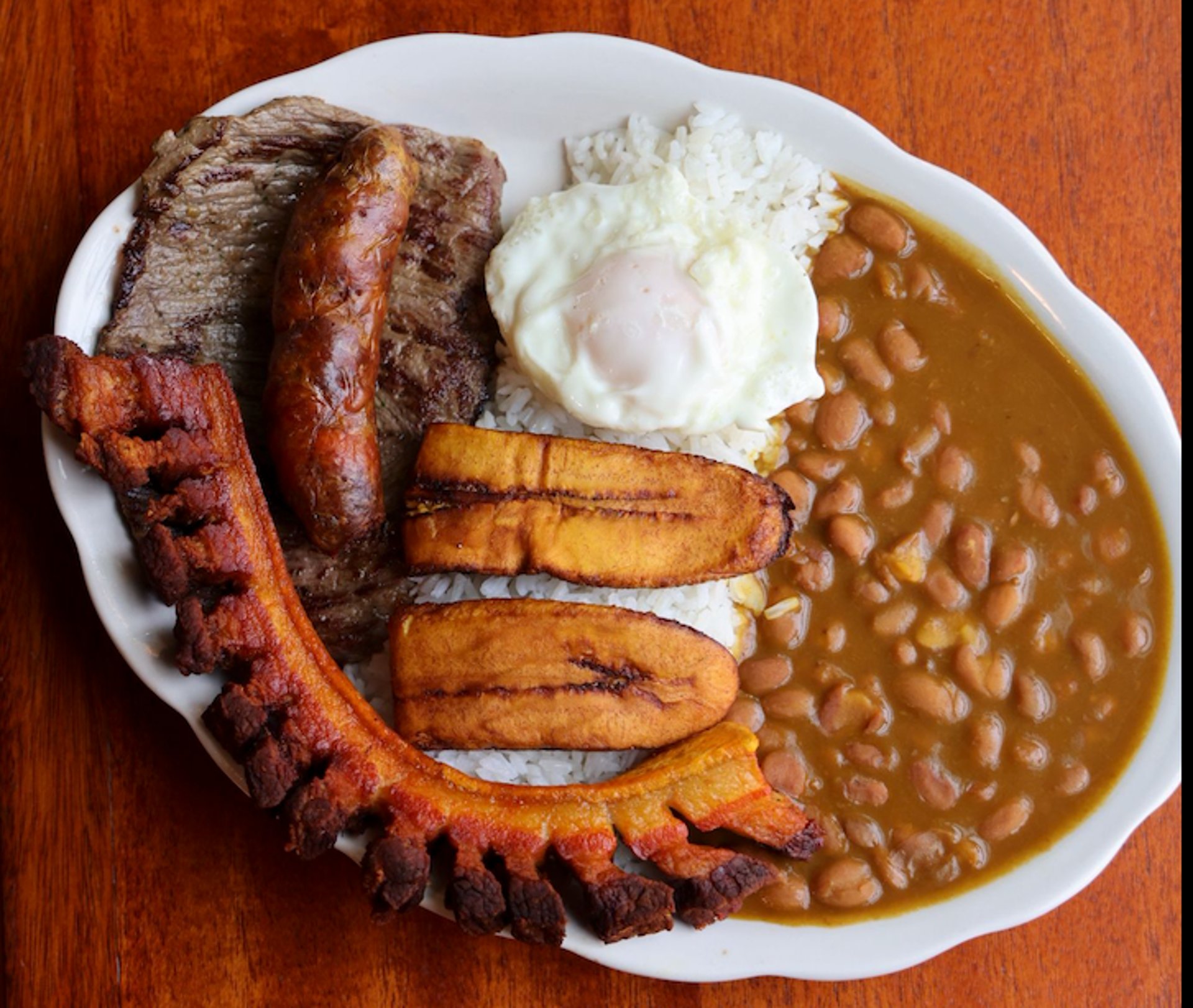 A plate of an Authentic Colombian Bandeja Paisa