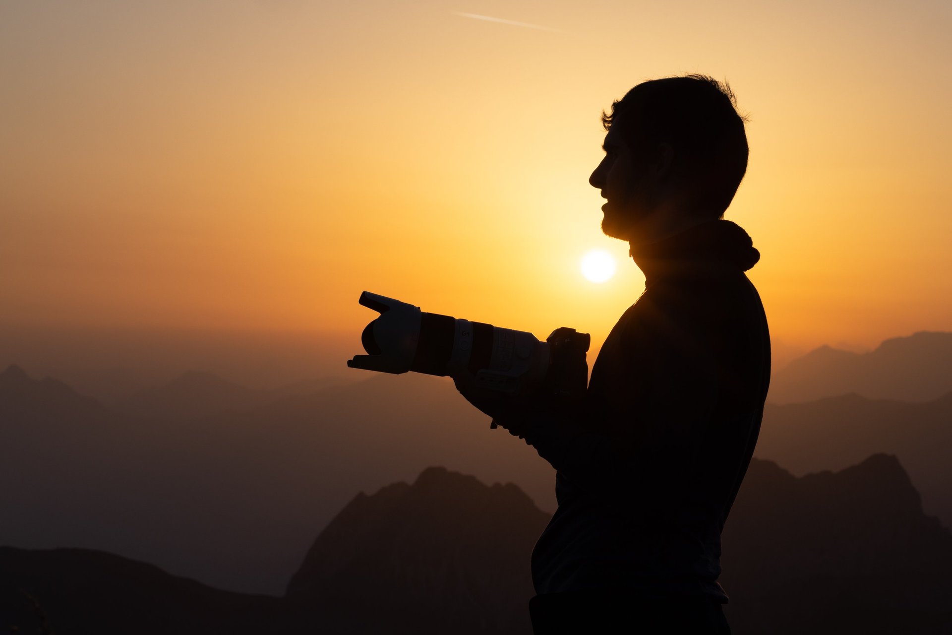 an abstract photo of a curved building with a blue sky in the background