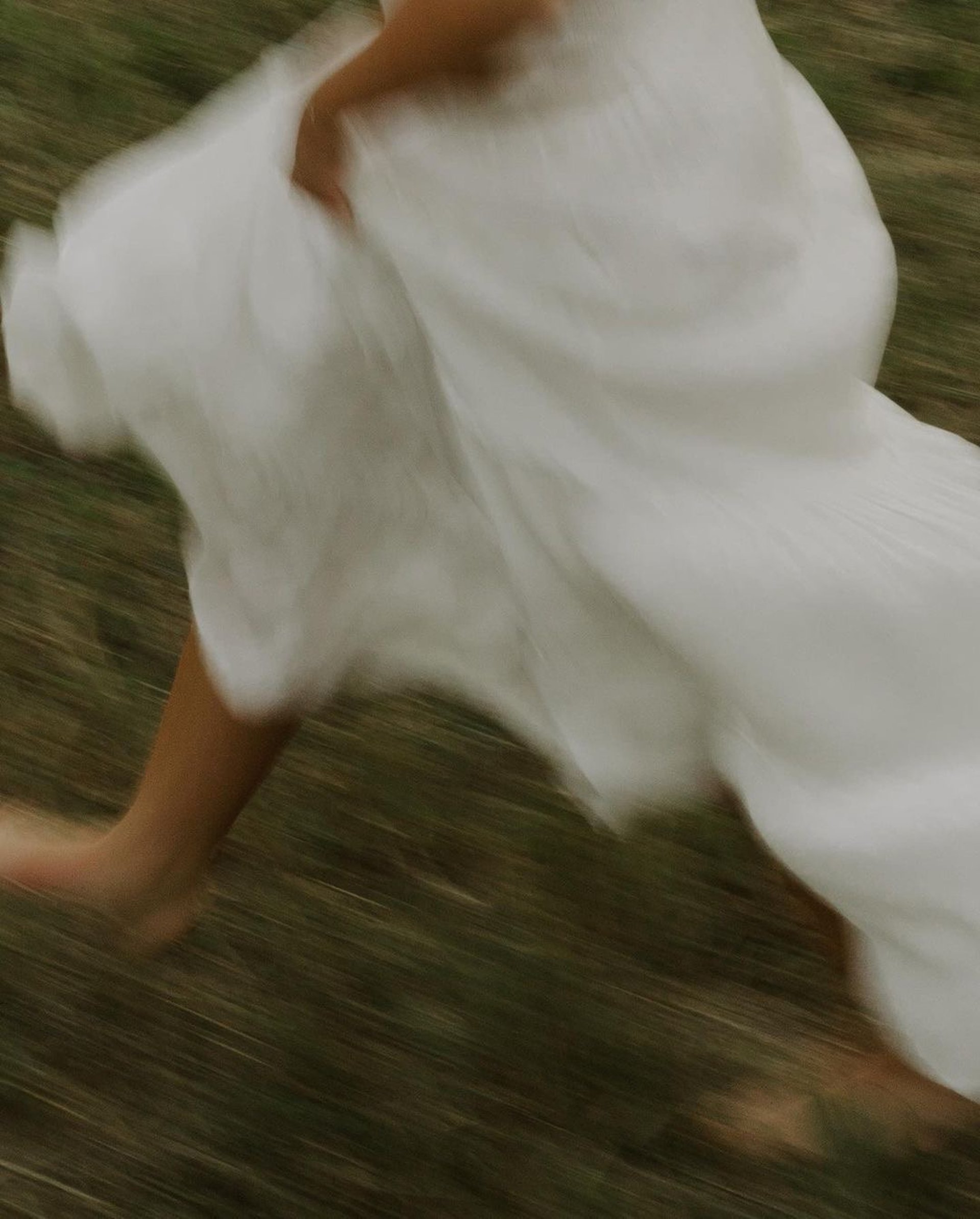 an abstract photo of a curved building with a blue sky in the background