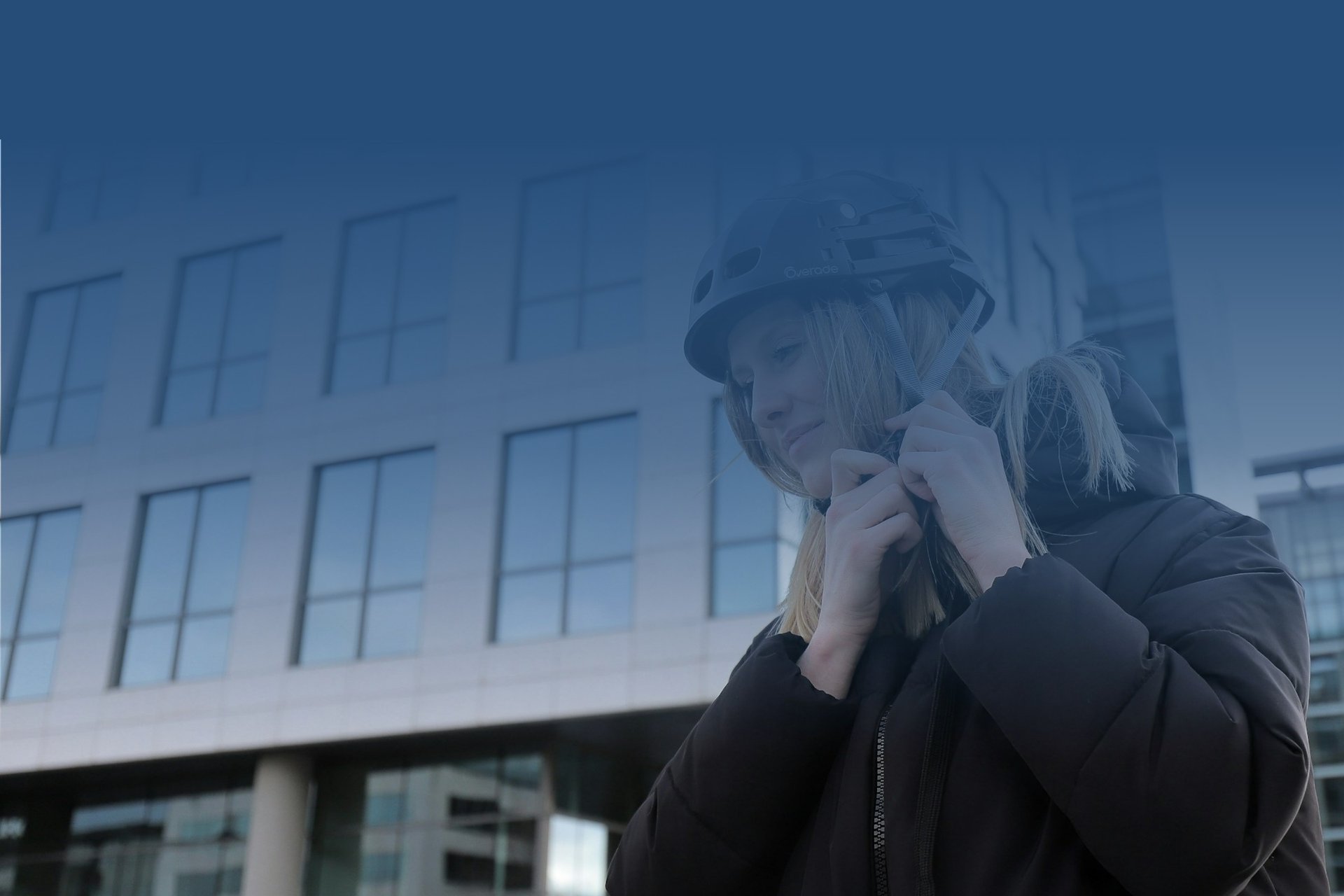 a woman wearing a helmet talking on a cell phone